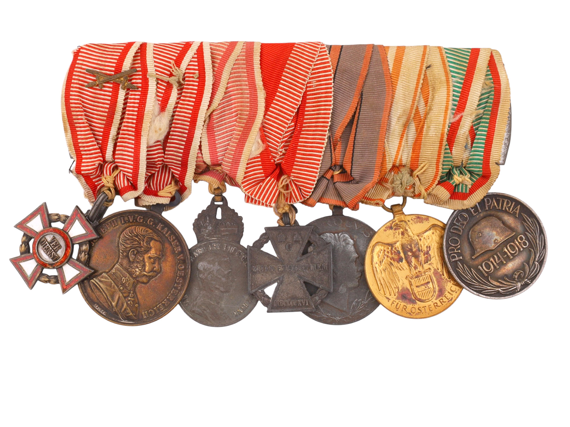AN AUSTRO-HUNGARIAN WORLD WAR I VETERAN'S MEDAL BAR WITH MILITARY MERIT CROSS, BRAVERY MEDAL, SIGNUM LAUDIS, KARL TRUPPENKREUZ AND COMMEMORA