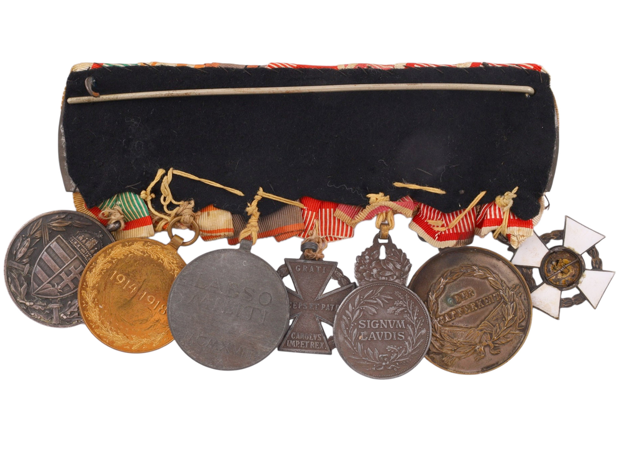 AN AUSTRO-HUNGARIAN WORLD WAR I VETERAN'S MEDAL BAR WITH MILITARY MERIT CROSS, BRAVERY MEDAL, SIGNUM LAUDIS, KARL TRUPPENKREUZ AND COMMEMORA