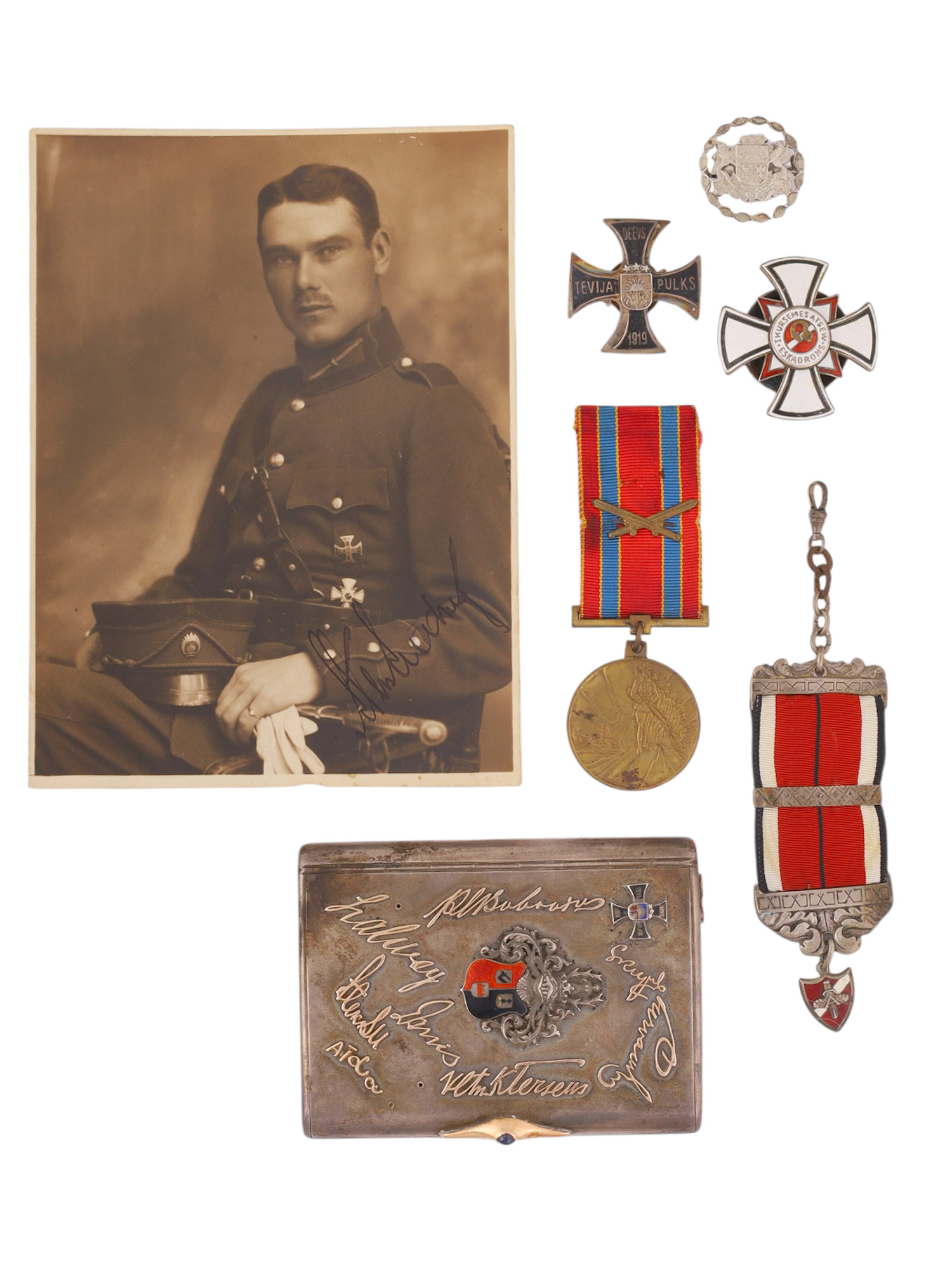 A LATVIAN MILITARY VETERAN'S GROUPING WITH PHOTOGRAPH, AWARDS AND PRESENTATION CIGARETTE CASE