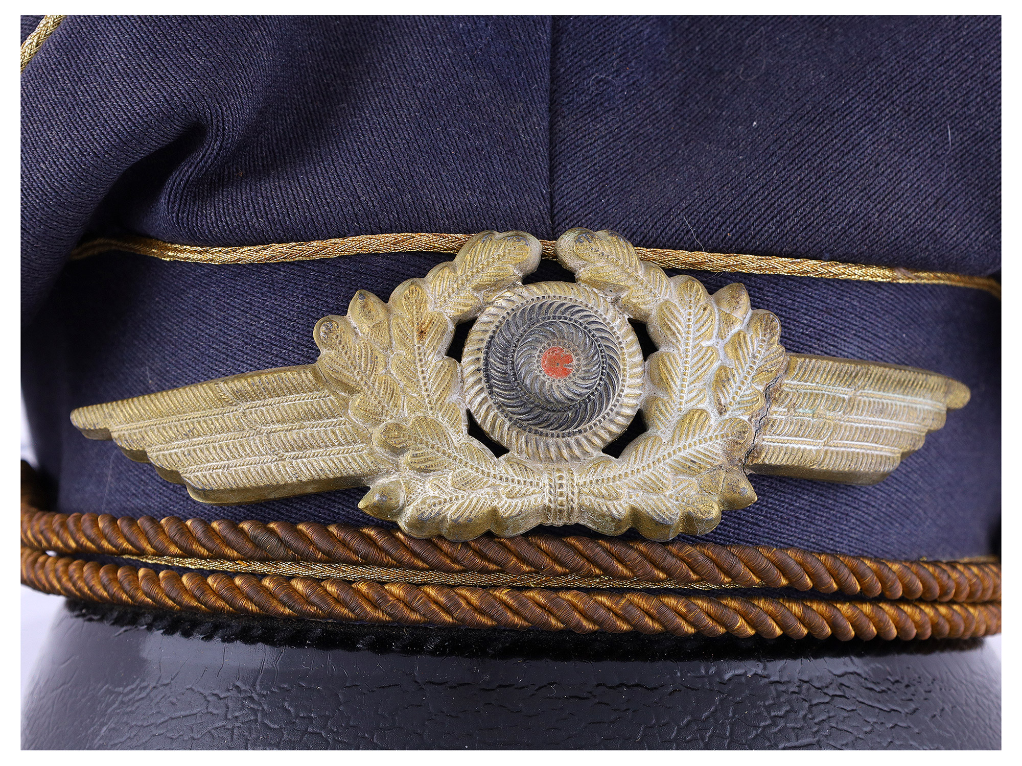 A LUFTWAFFE OFFICER’S VISOR CAP (SCHIRMMÜTZE), WWII GERMANY, NAMED TO MICHAEL BÖRHEL