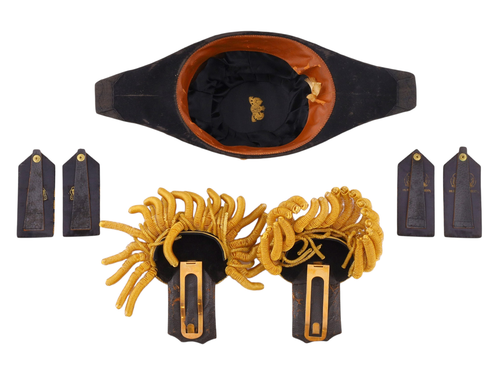 A BRITISH ROYAL NAVY CAPTAIN'S FULL DRESS BICORNE HAT AND EPAULETTES IN A TOLE CASE