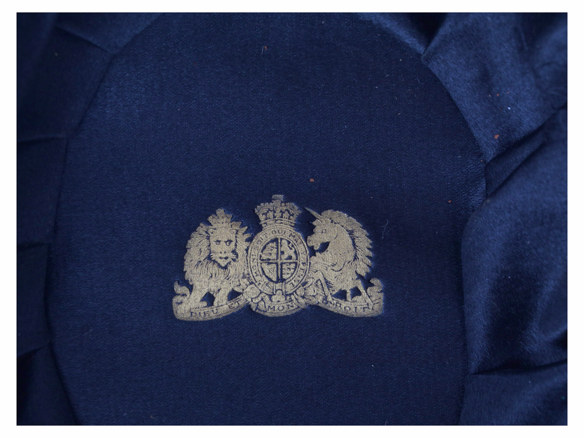 A BRITISH ROYAL NAVY CAPTAIN'S FULL DRESS BICORNE HAT AND EPAULETTES IN A TOLE CASE