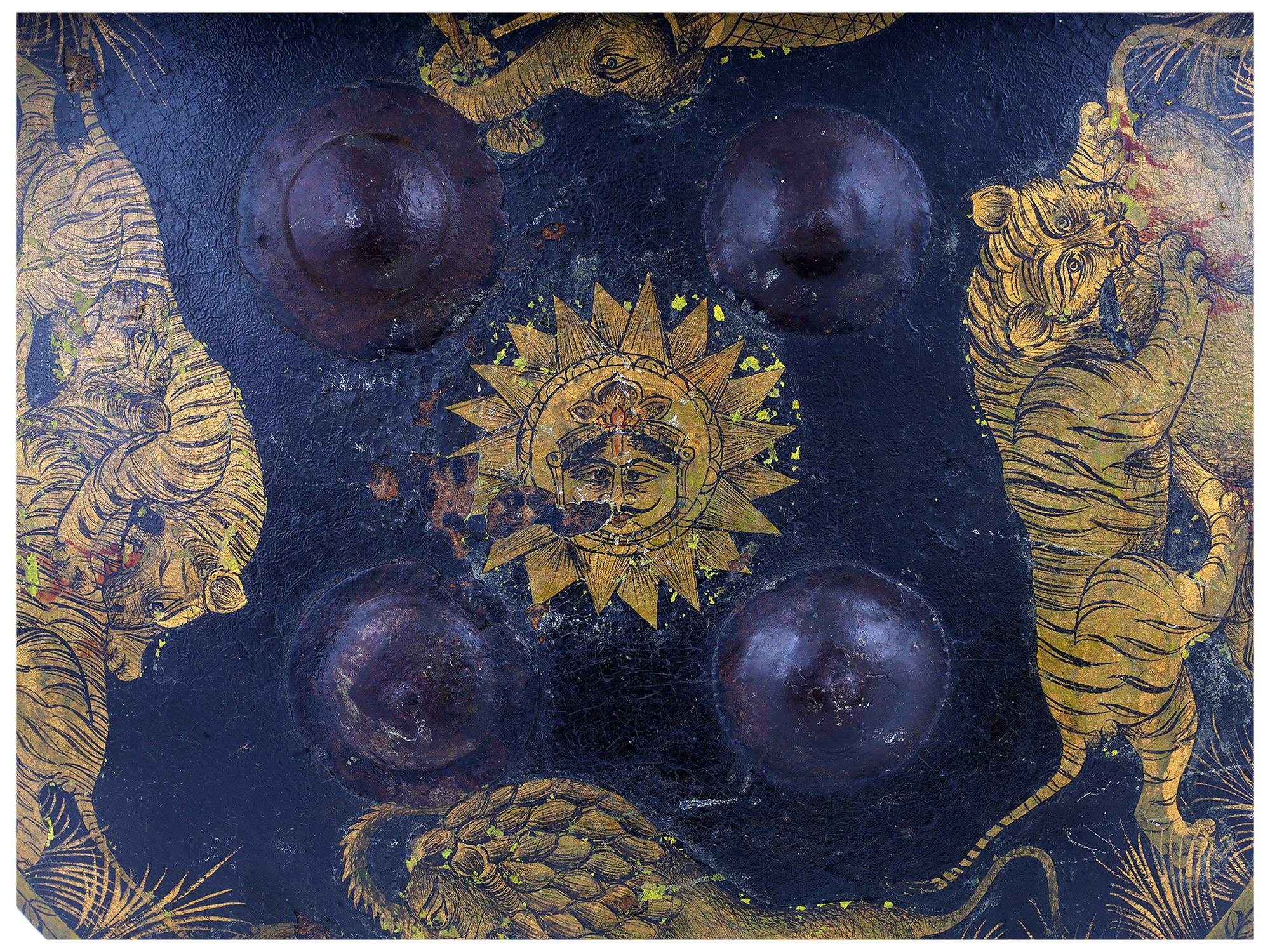 AN INDIAN PAINTED AND GILT HIDE DHAL SHIELD, LATE 19TH CENTURY