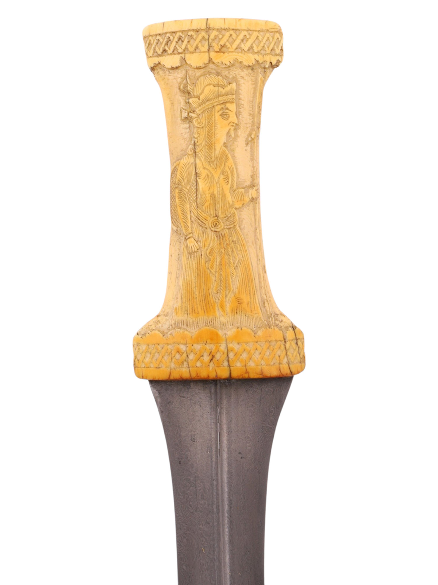 A QAJAR PERSIAN JAMBIYA WITH WOOTZ BLADE AND CARVED BONE GRIP, 19TH CENTURY