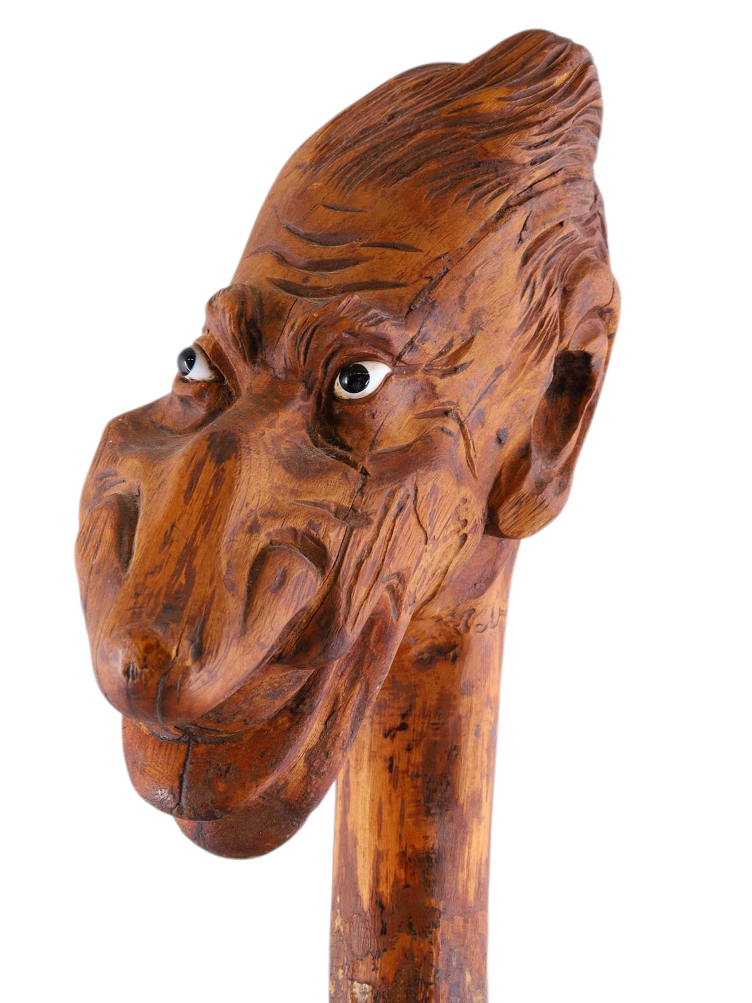 A LARGE CARVED WOOD WALKING STICK WITH MYTHOLOGICAL MASKED HANDLE, LATE 19TH CENTURY