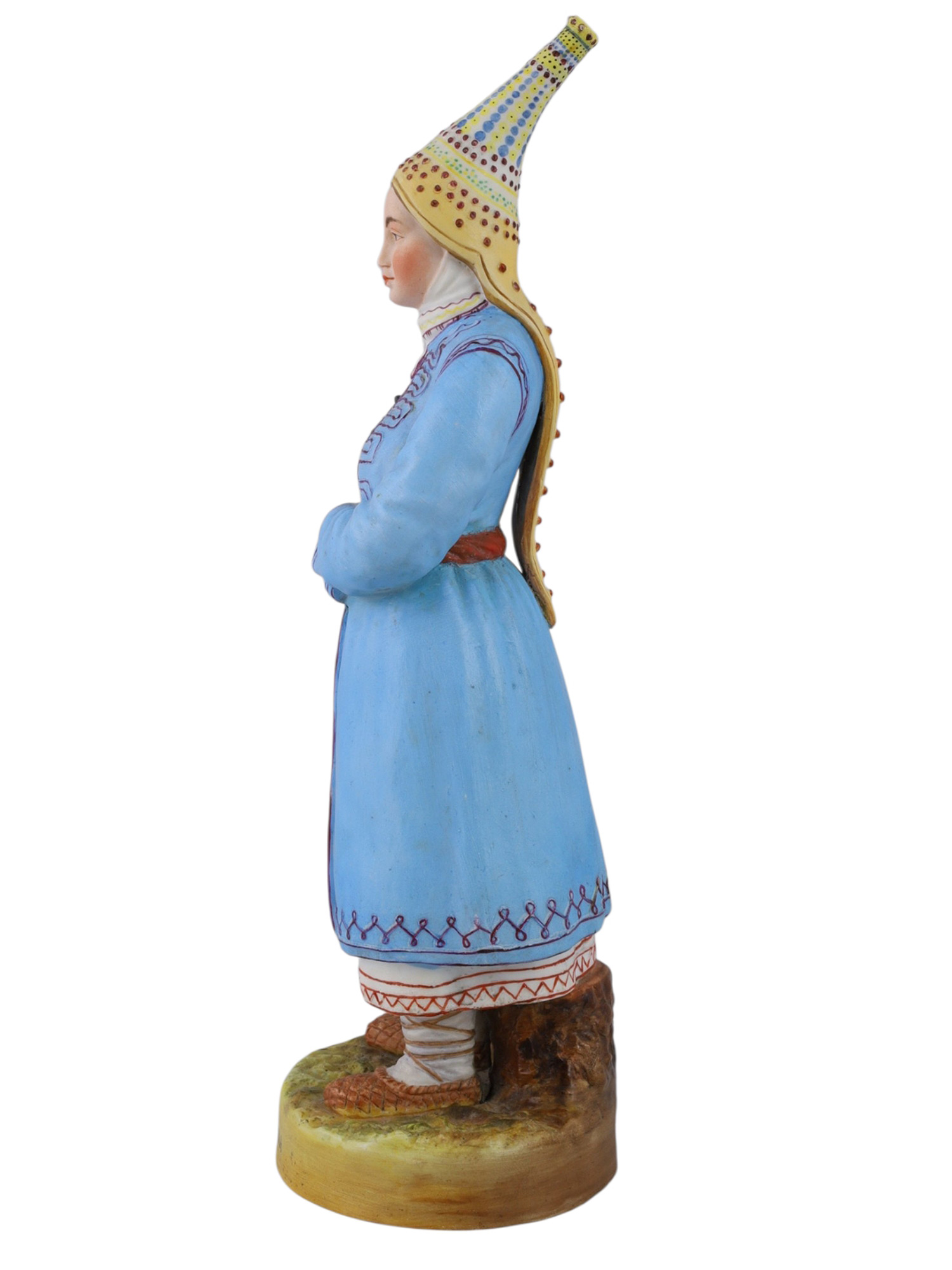 A RUSSIAN GARDNER PORCELAIN FIGURE OF A CHEREMIS (MARI) WOMAN, 19TH CEN.