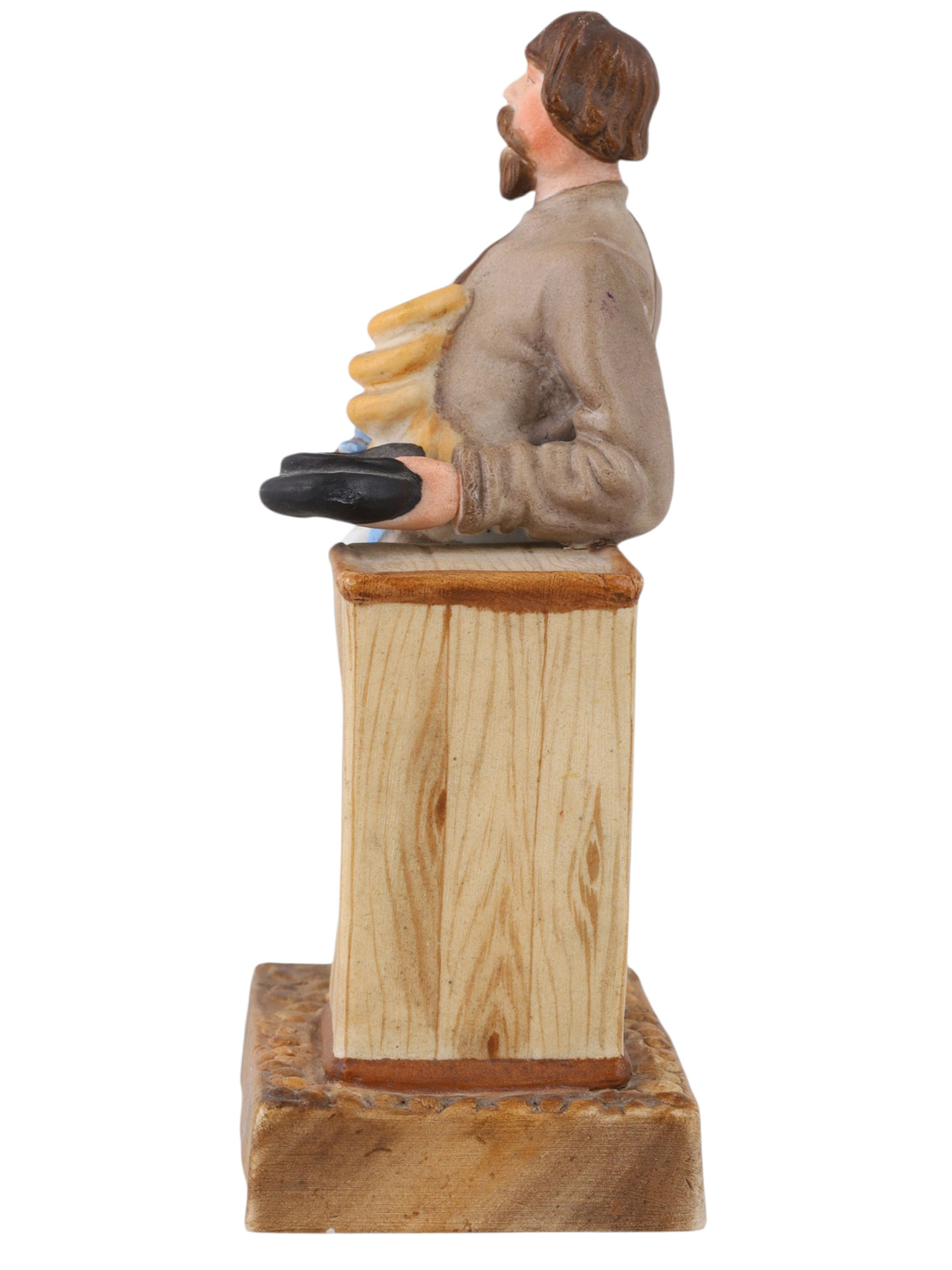 A RUSSIAN KUZNETSOV/GARDNER PORCELAIN FIGURE OF A SBITEN VENDOR, 19TH CENTURY