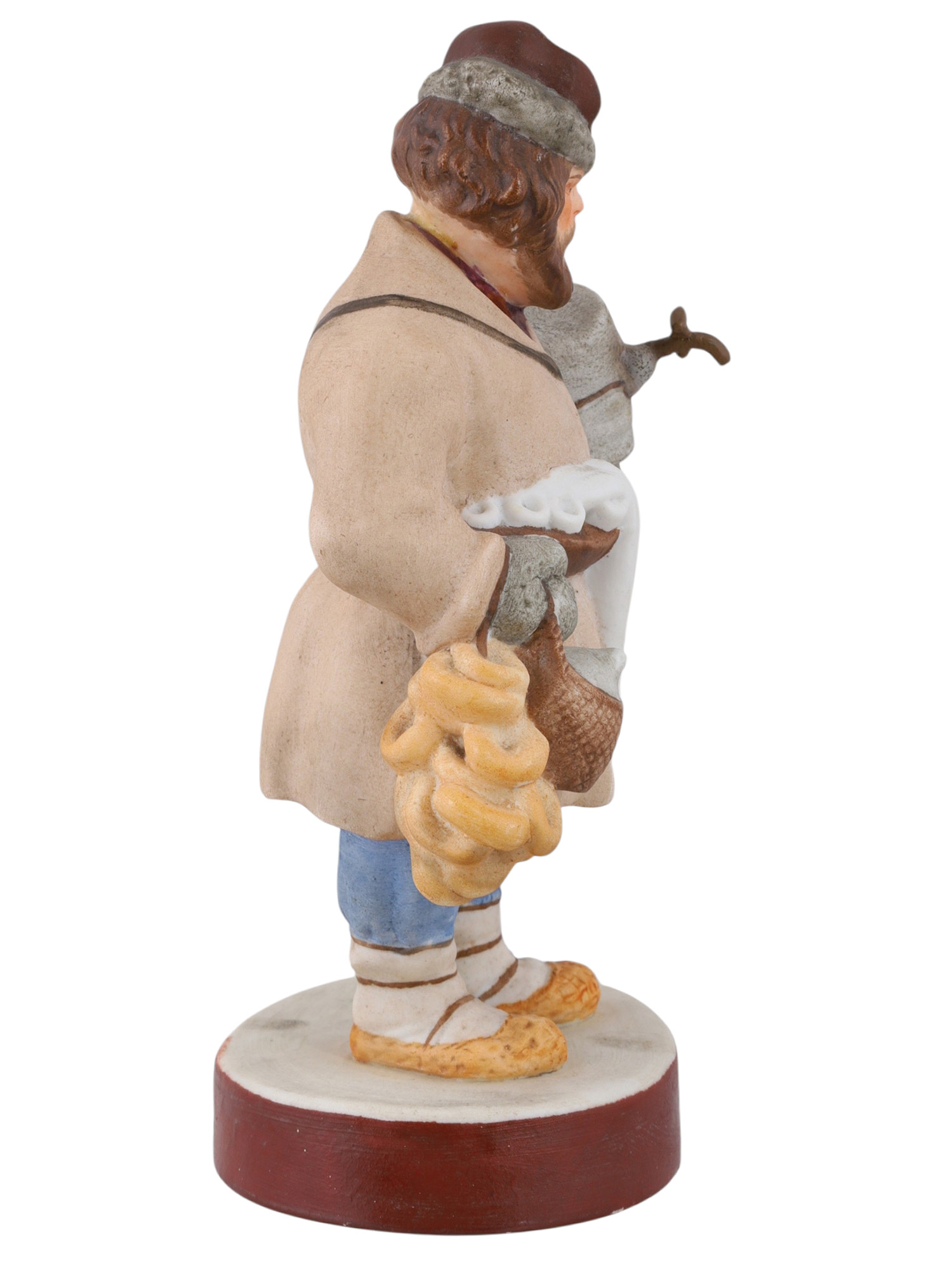 A RUSSIAN PORCELAIN FIGURE OF A SBITEN VENDOR