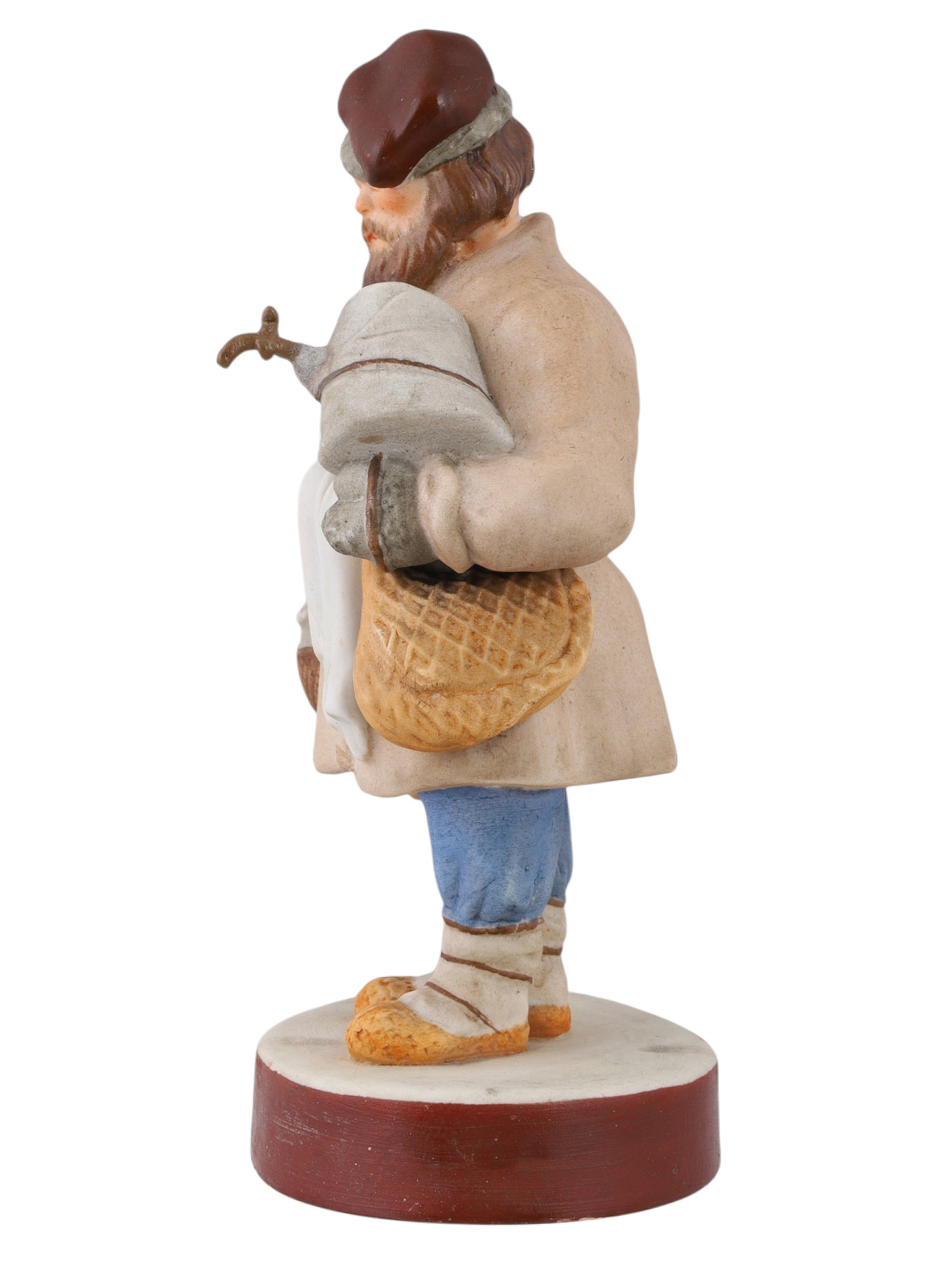 A RUSSIAN PORCELAIN FIGURE OF A SBITEN VENDOR