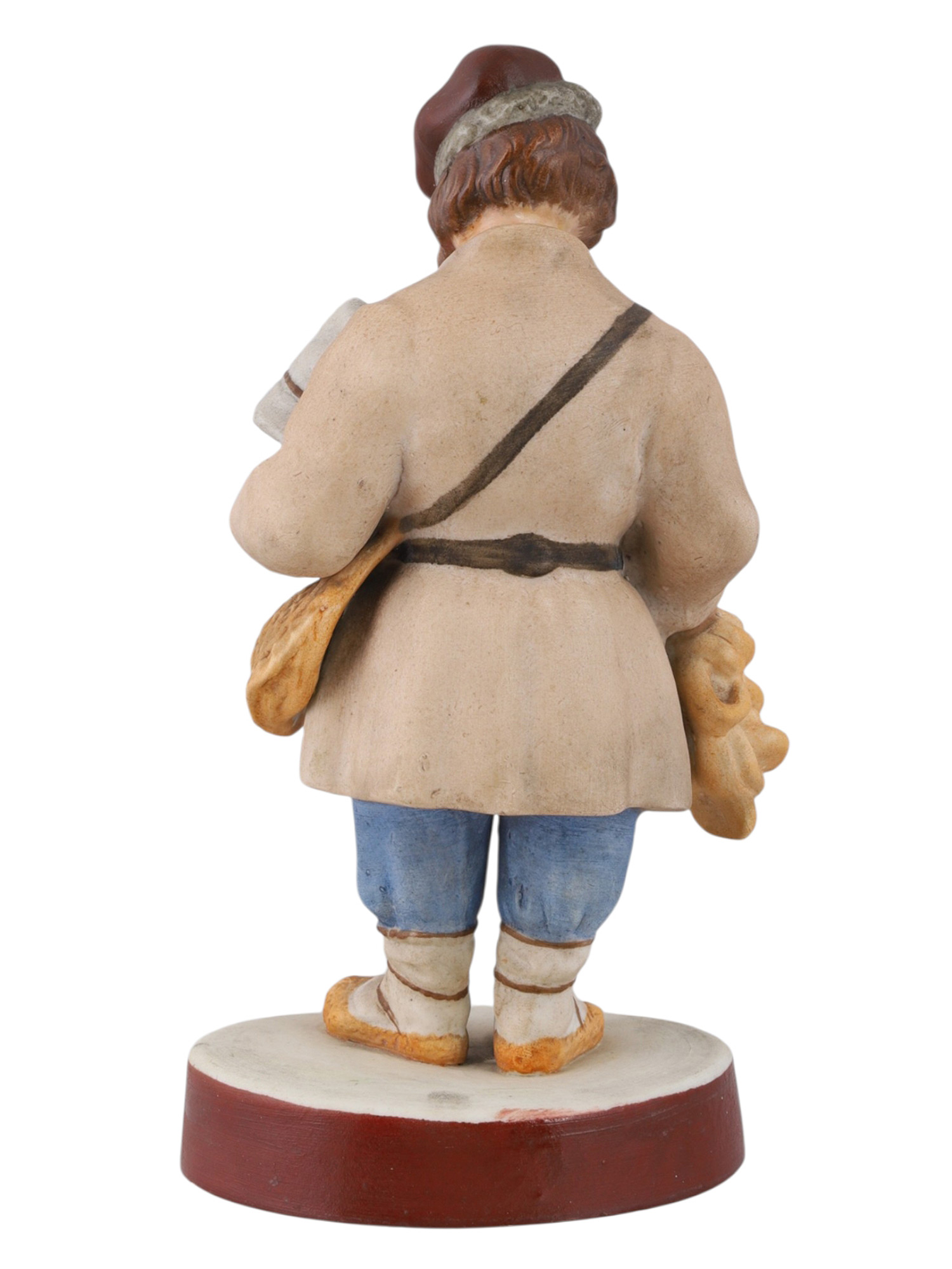 A RUSSIAN PORCELAIN FIGURE OF A SBITEN VENDOR