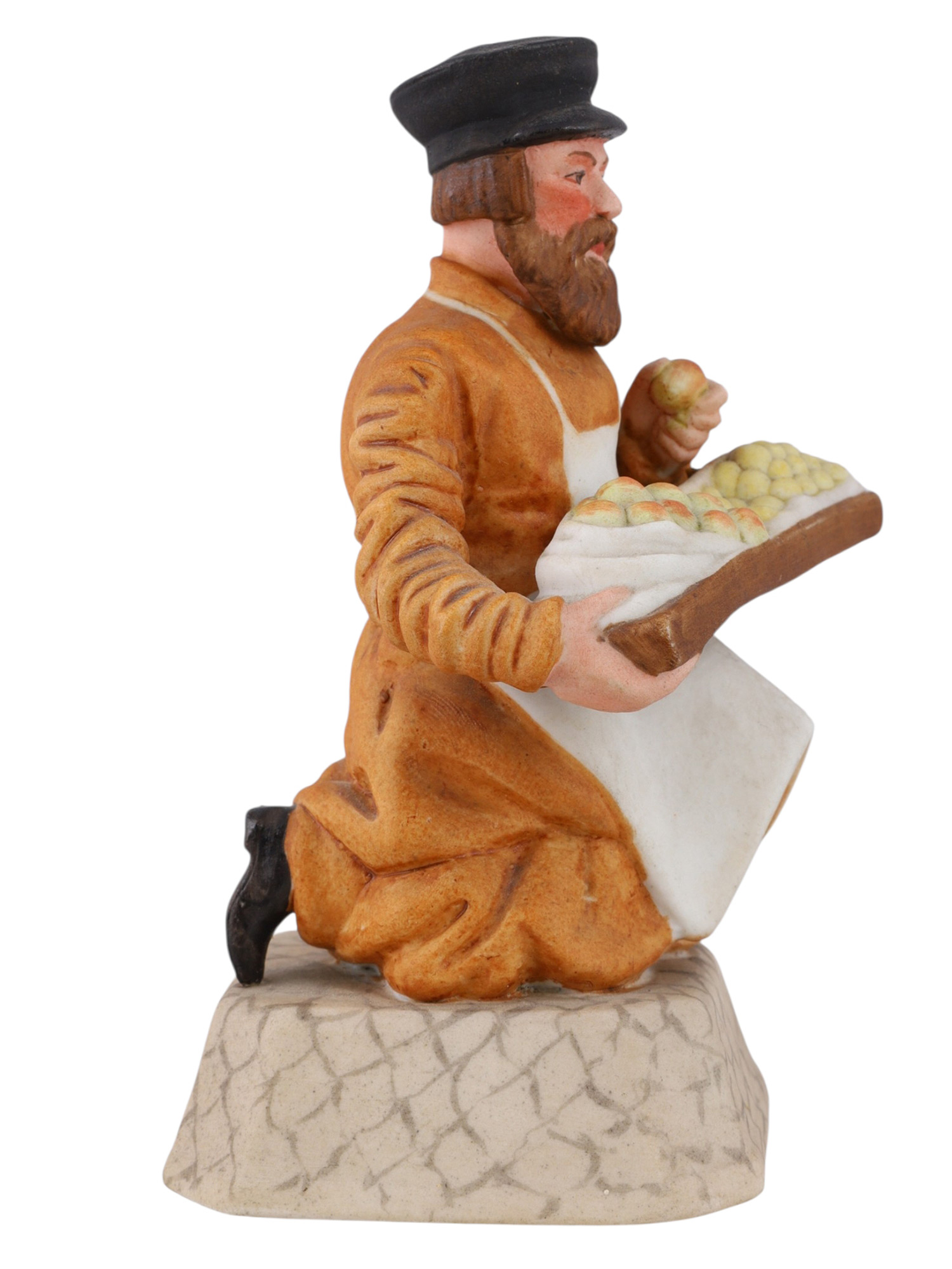 A RUSSIAN PORCELAIN FIGURE OF A FOOD VENDOR BY THE GARDNER PORCELAIN FACTORY, VERBILKI, LATE 19TH CENTURY