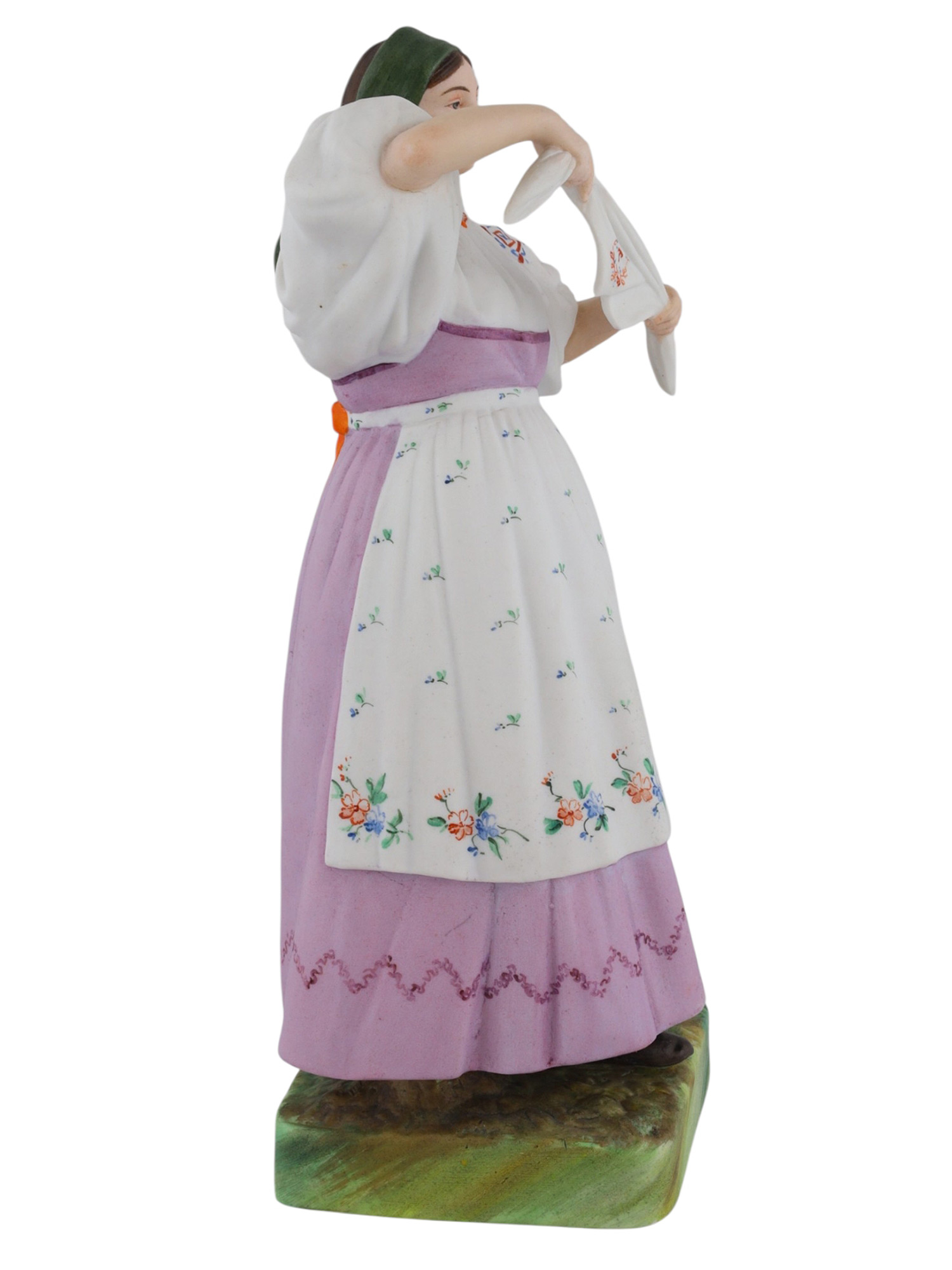 A RUSSIAN KUSNETSOV PORCELAIN FIGURE OF A WOMAN, 19TH CENTURY