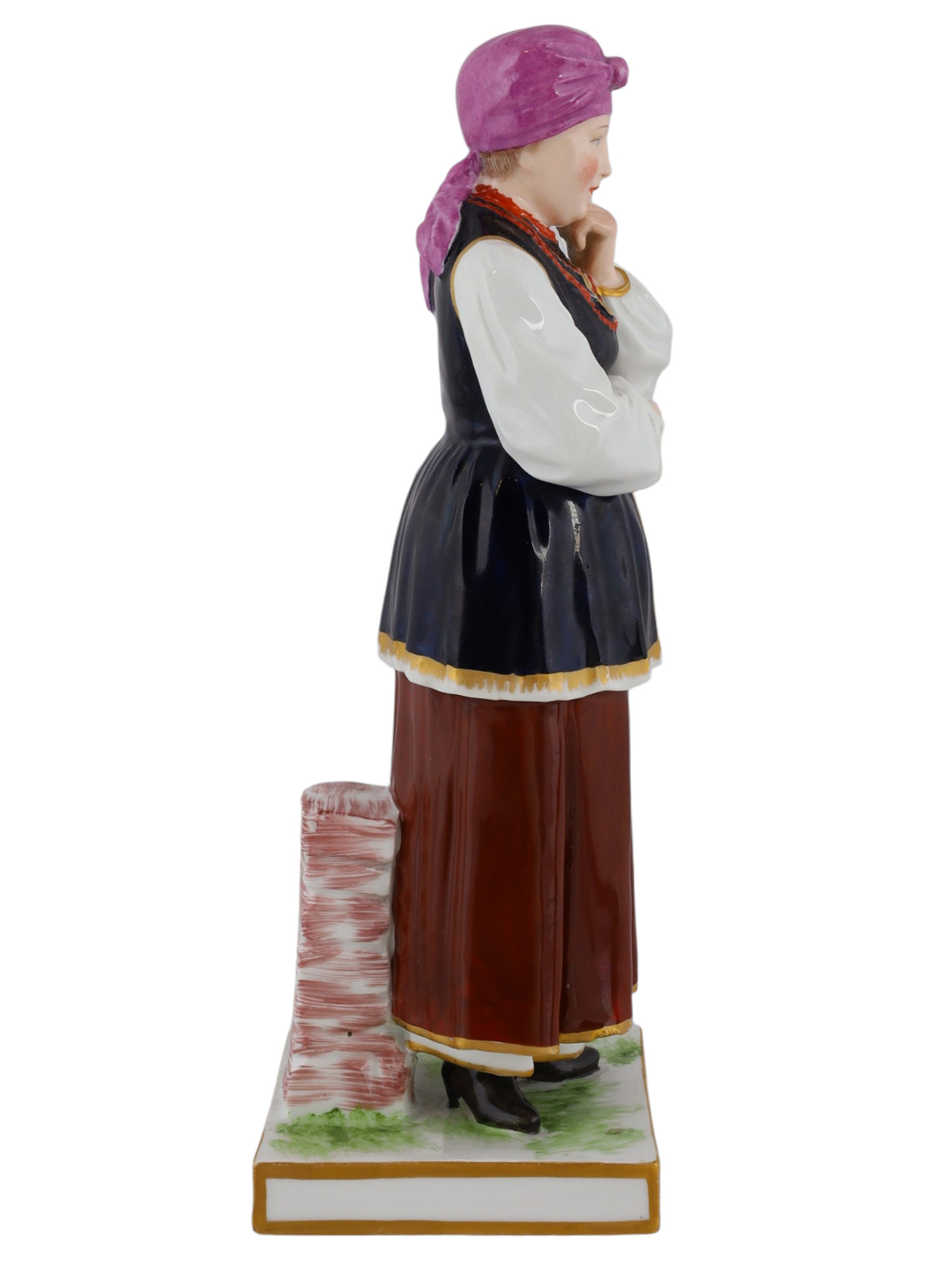 A RUSSIAN POPOV PORCELAIN FIGURE OF A UKRAINIAN WOMAN