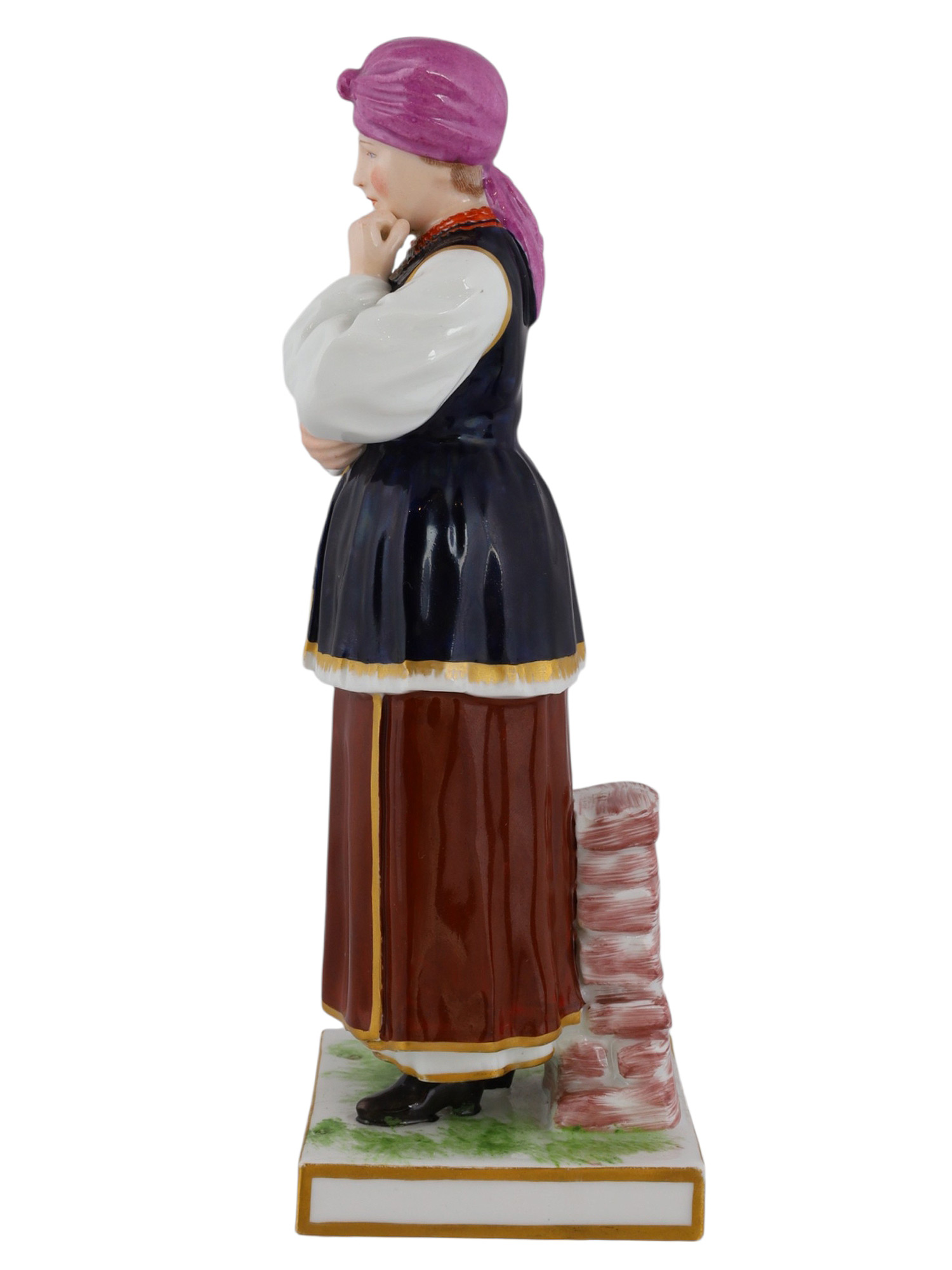 A RUSSIAN POPOV PORCELAIN FIGURE OF A UKRAINIAN WOMAN