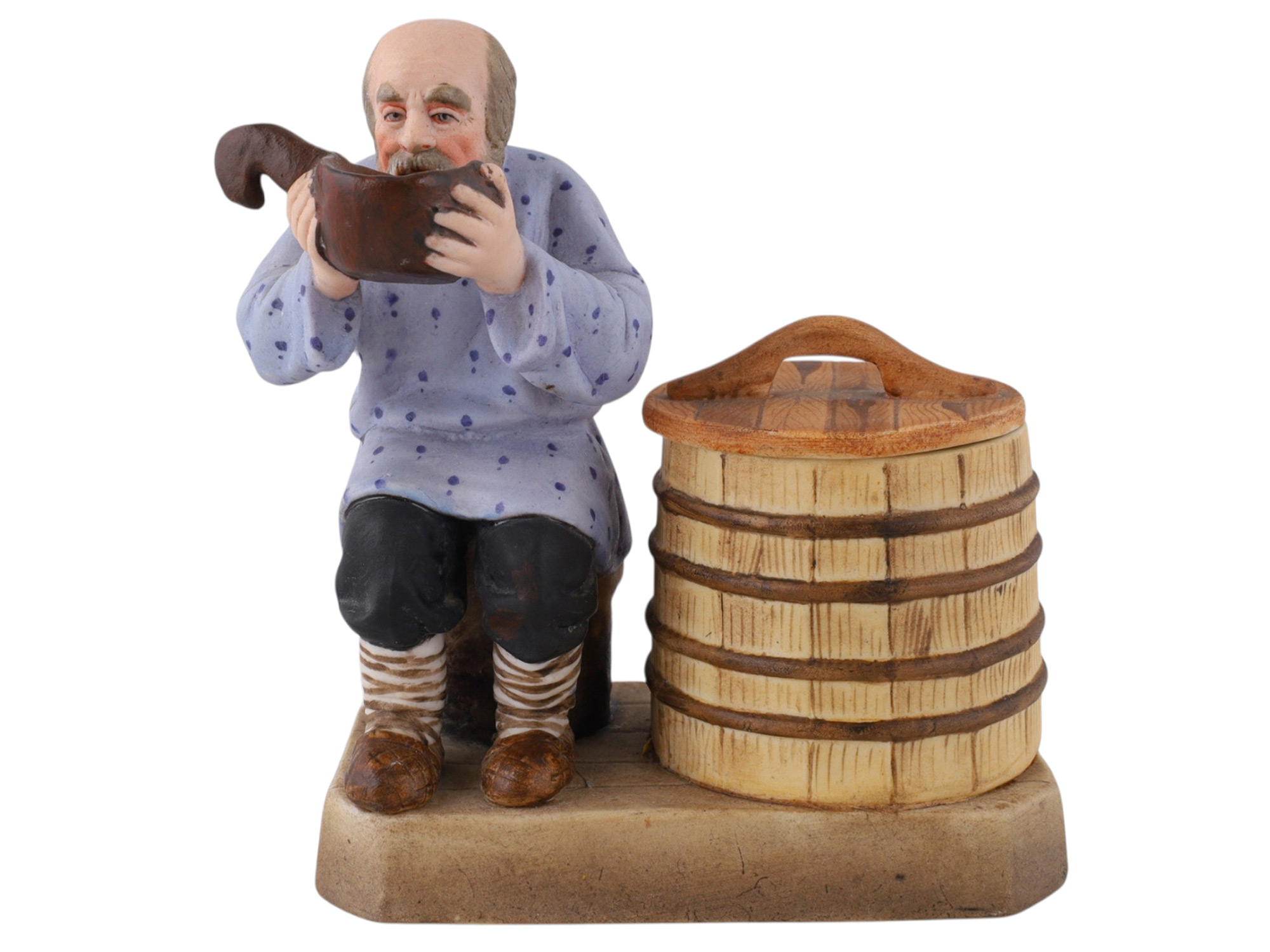 A SOVIET VERBILKI PORCELAIN FIGURAL COVERED SALT CELLAR, "THE PEASANT DRINKING FROM A KOVSH"