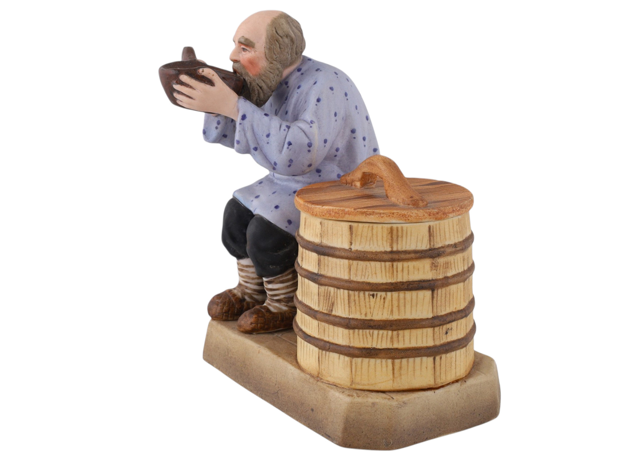 A SOVIET VERBILKI PORCELAIN FIGURAL COVERED SALT CELLAR, "THE PEASANT DRINKING FROM A KOVSH"