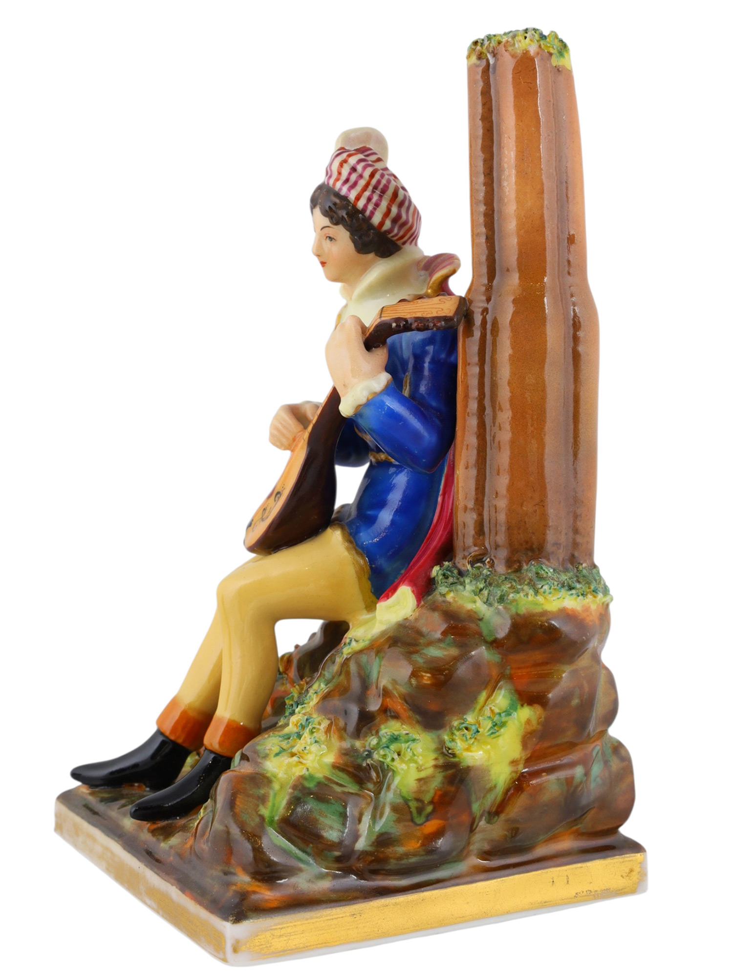 A RUSSIAN PORCELAIN FIGURE OF A MUSICIAN, POPOV FACTORY, C. 1860