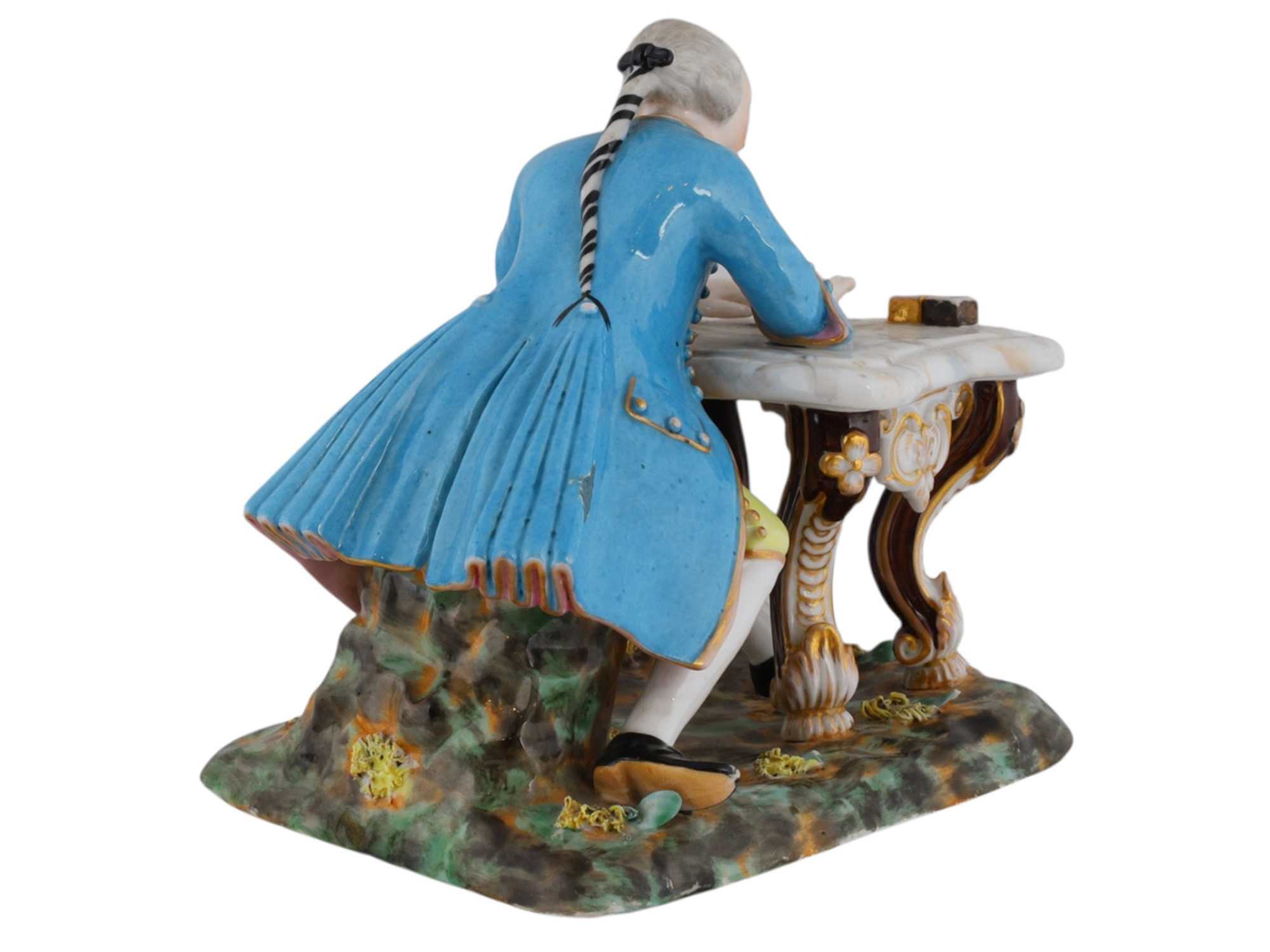 A RUSSIAN PORCELAIN FIGURE OF A WRITING NOBLE ATTRIBUTED TO MIKLASHEVSKIY FACTORY
