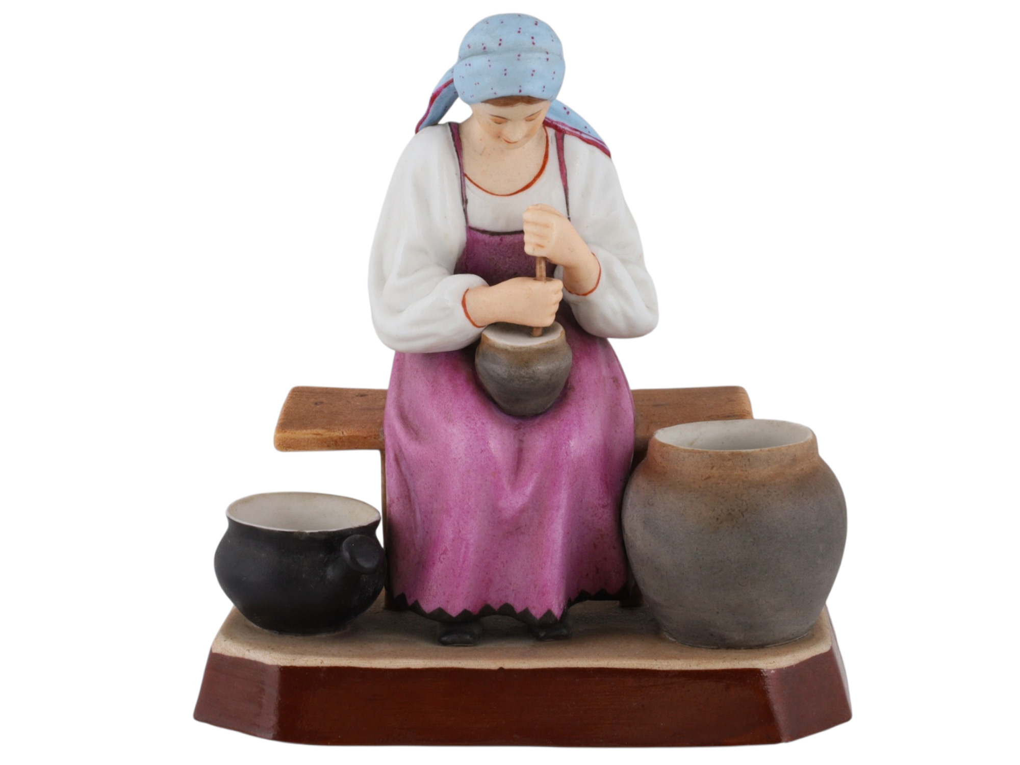 A RUSSIAN GARDNER PORCELAIN FIGURE OF A PEASANT WOMAN AT WORK, 19TH CEN.