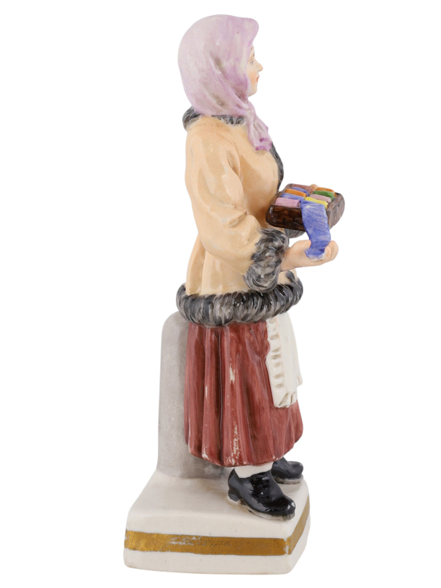 A RUSSIAN POPOV PORCELAIN FIGURE OF A WOMAN SELLING RIBBON, 19TH CEN.