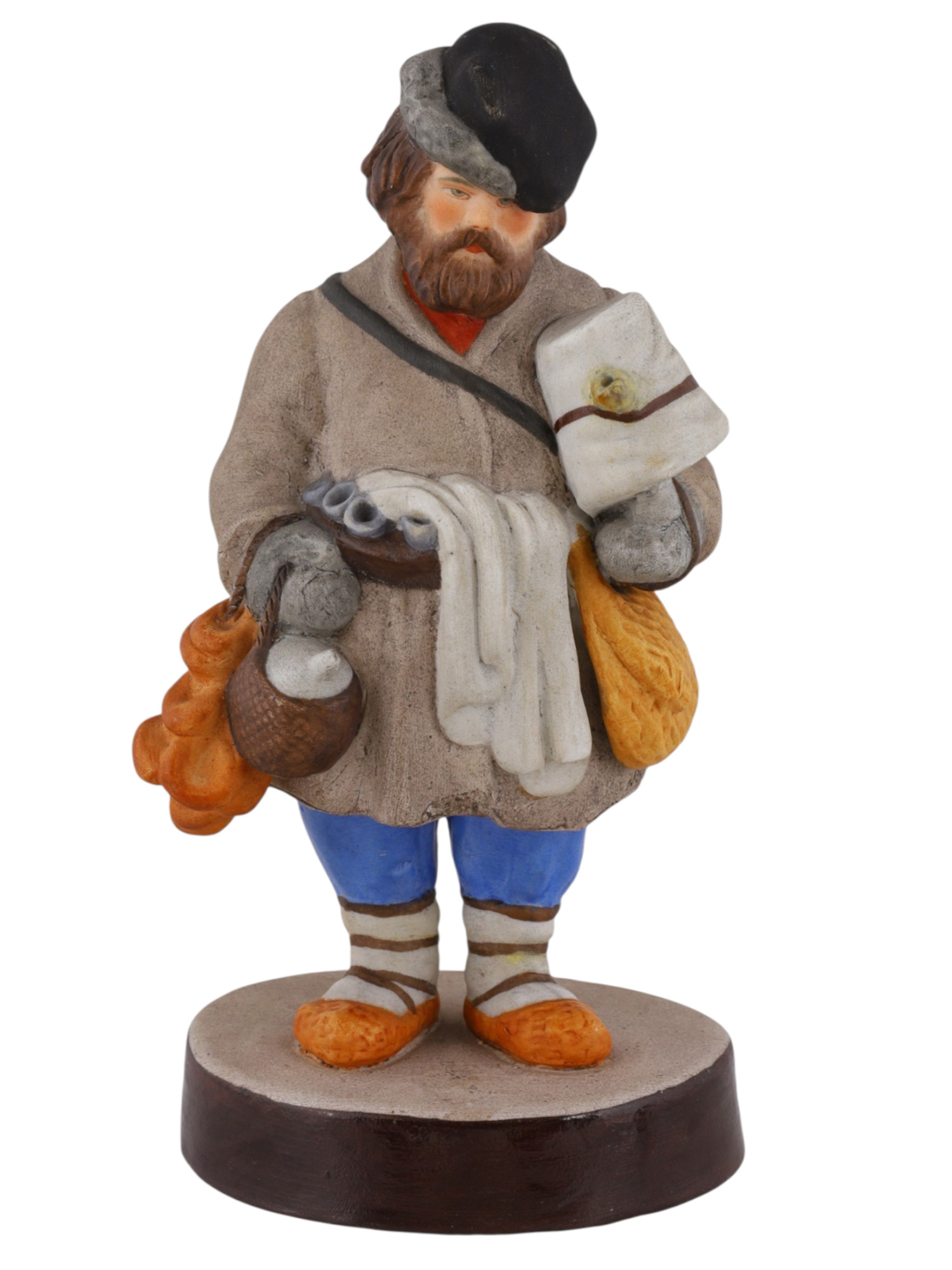 A RUSSIAN GARDENER PORCELAIN FIGURE OF A SBITENSCHIK, 19TH CENTURY