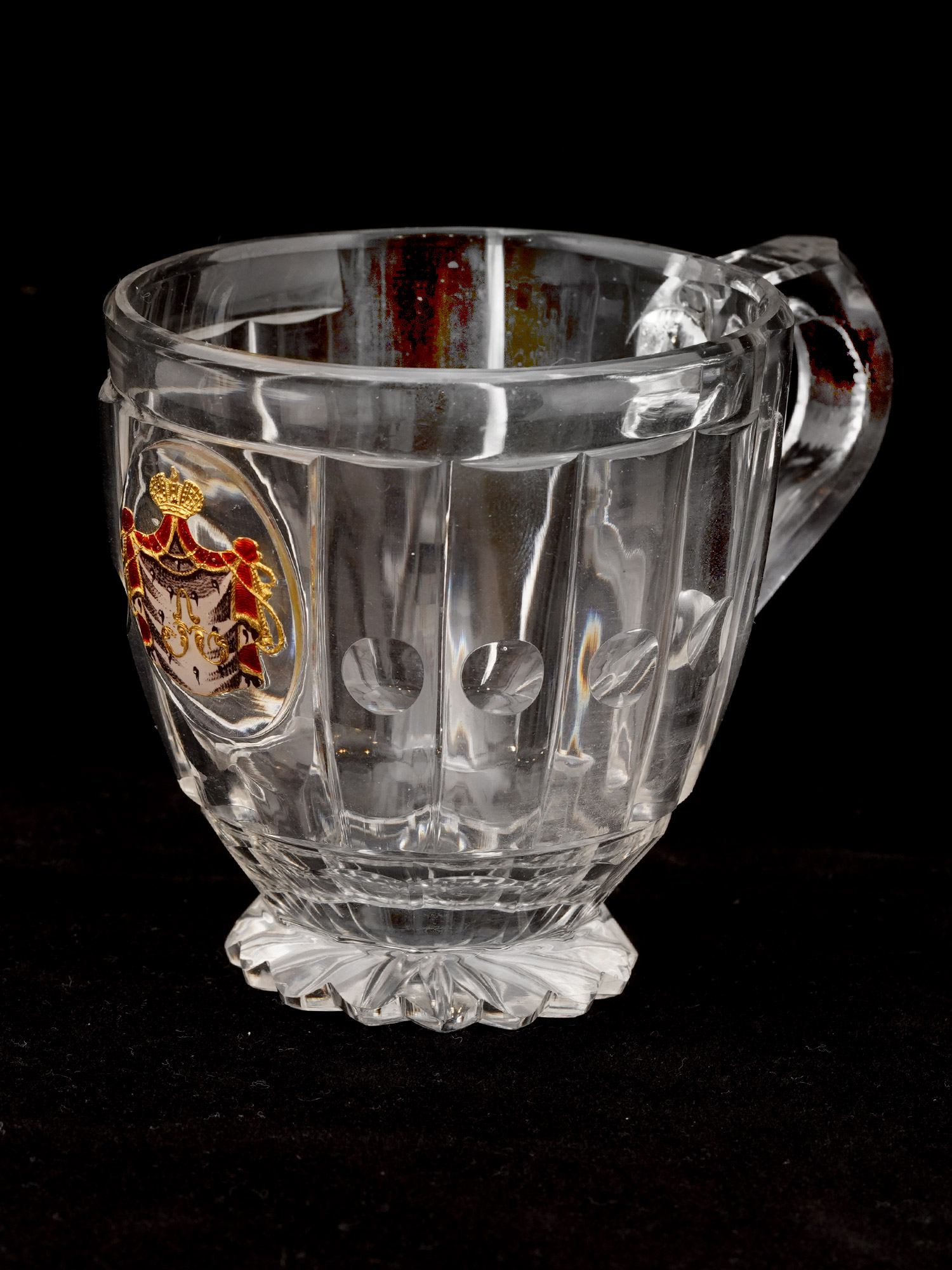 AN IMPERIAL RUSSIAN CUT-GLASS HANDLED CUP FROM A BANQUET SERVICE IMPERIAL GLASS FACTORY, ST PETERSBURG, CIRCA 1850S