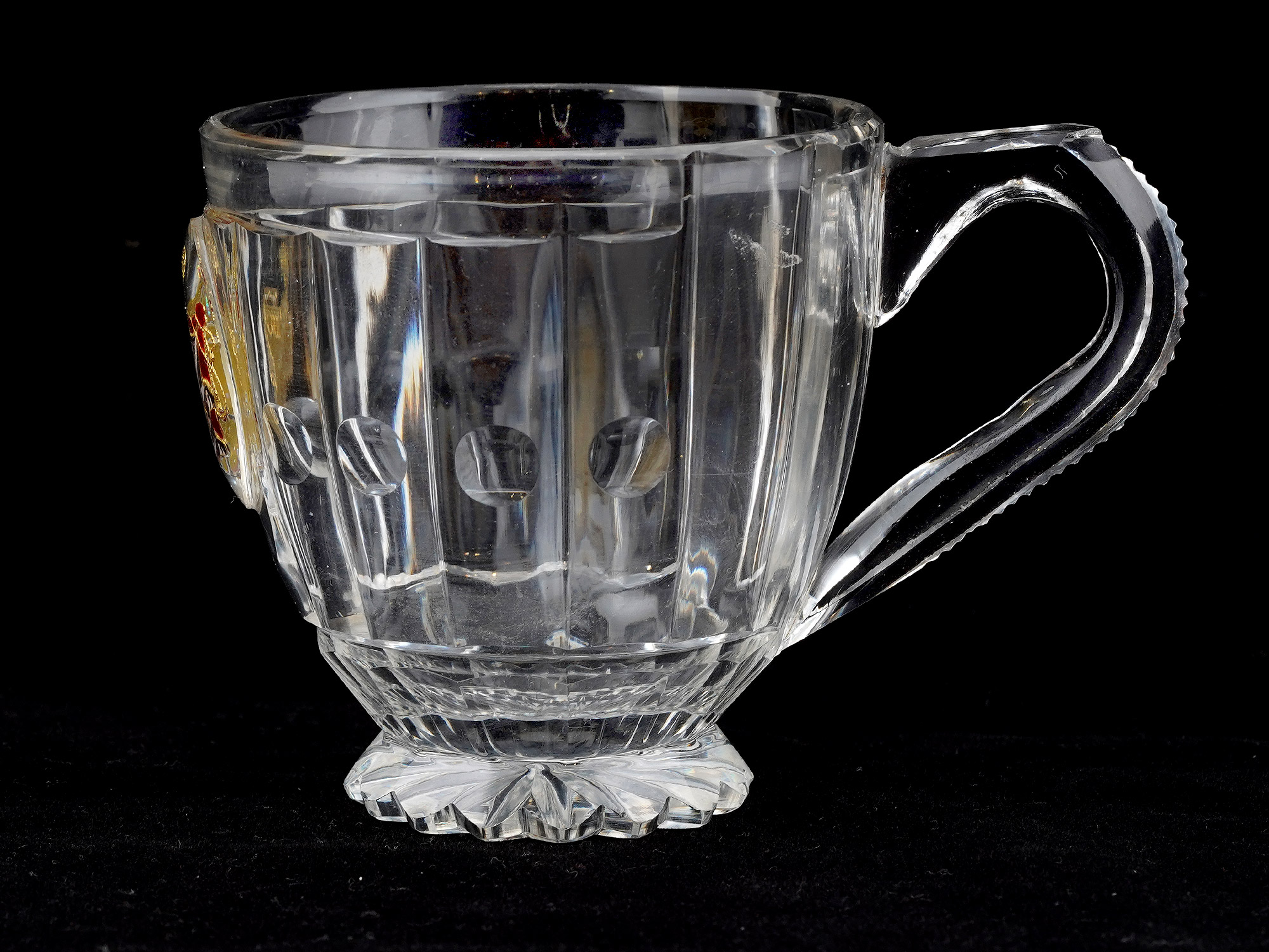 AN IMPERIAL RUSSIAN CUT-GLASS HANDLED CUP FROM A BANQUET SERVICE IMPERIAL GLASS FACTORY, ST PETERSBURG, CIRCA 1850S