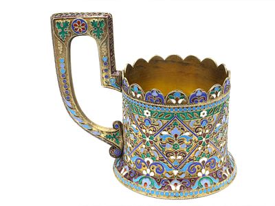 A RUSSIAN PARCEL-GILT-SILVER AND CLOISONNE ENAMEL TEA GLASS HOLDER. Russia, circa 1900. Of 