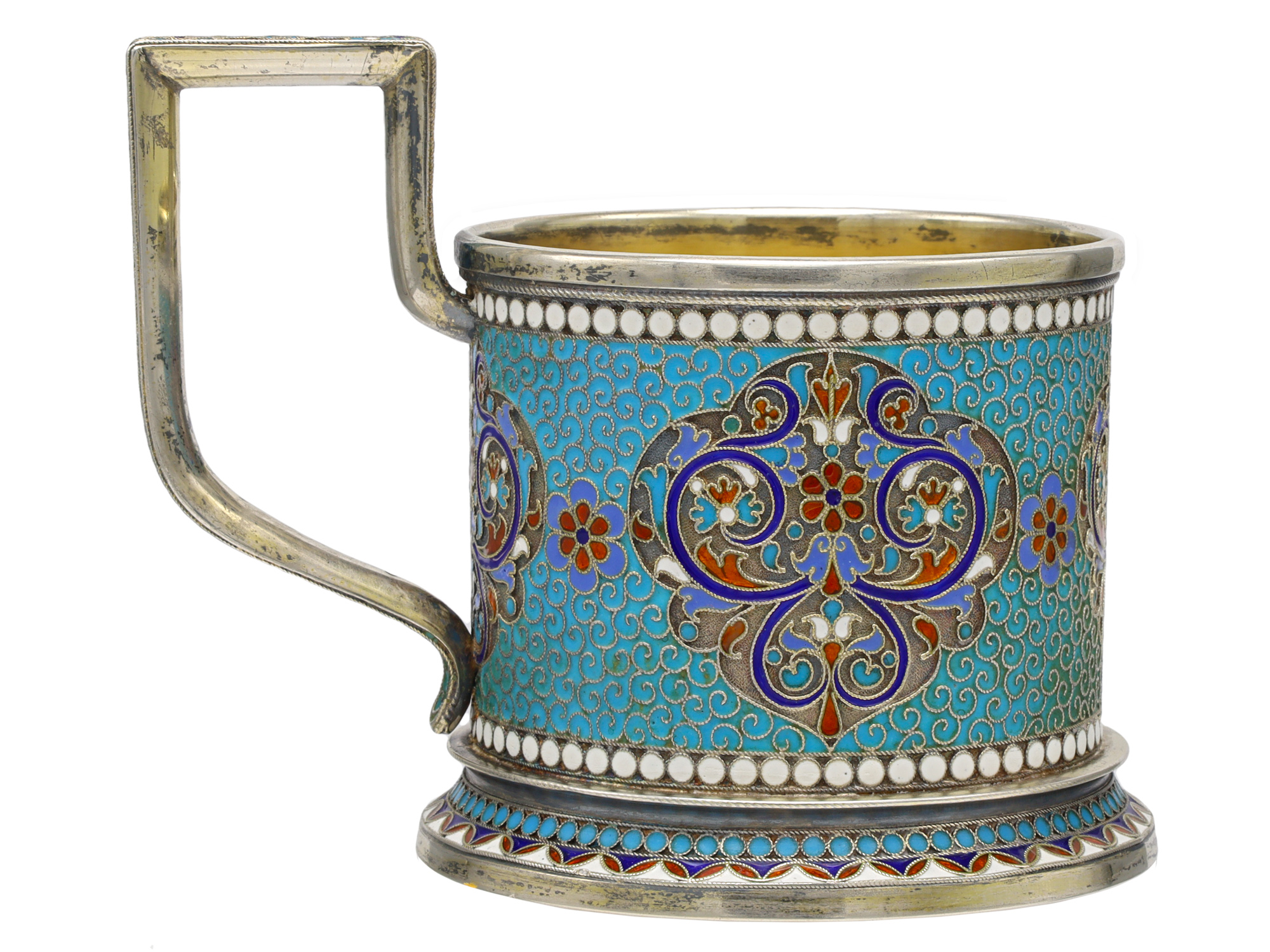 A RUSSIAN PARCEL-GILT SILVER AND CLOISONNÉ ENAMEL TEA GLASS HOLDER BY GUSTAV KLINGERT, 1895