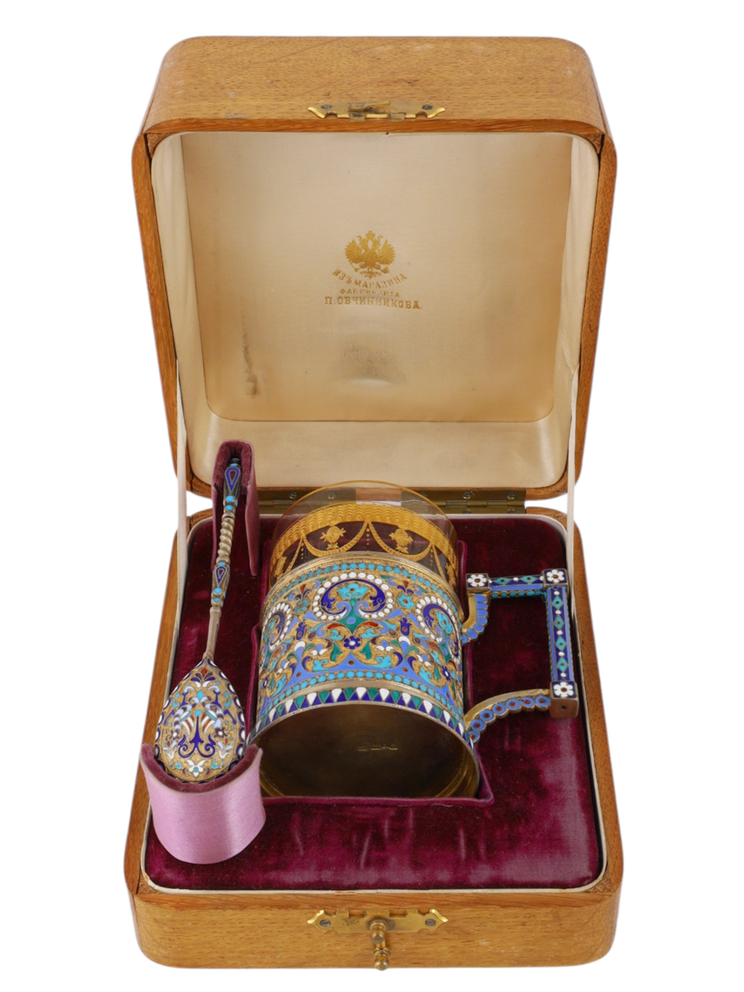 A CASED GILT-SILVER AND CLOISONNE ENAMEL TEAGLASS HOLDER, 1896 BY OVCHINNIKOV