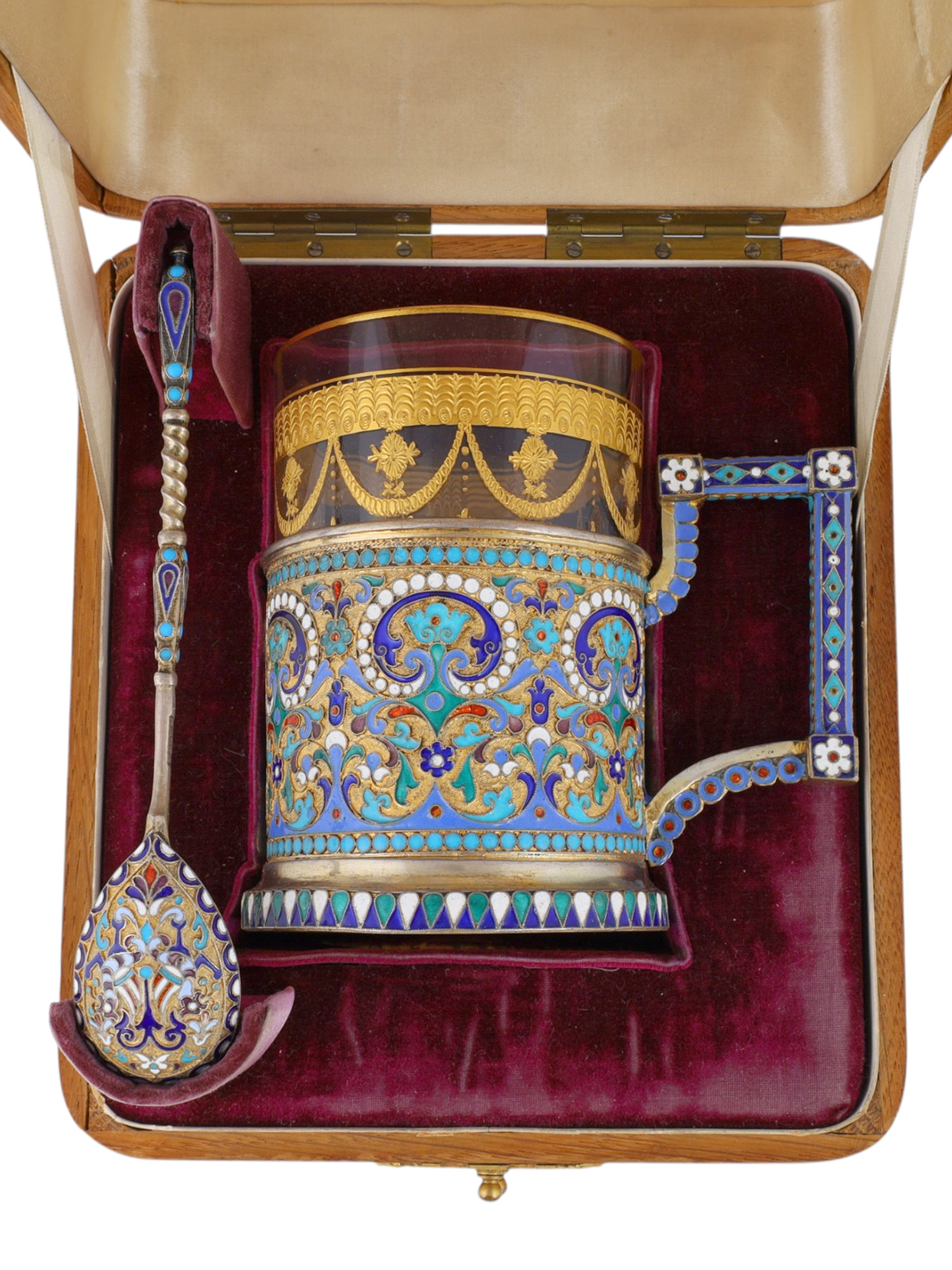 A CASED GILT-SILVER AND CLOISONNE ENAMEL TEAGLASS HOLDER, 1896 BY OVCHINNIKOV