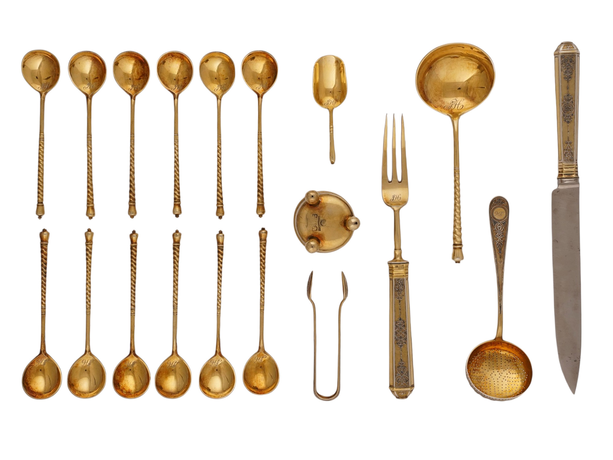 A RUSSIAN CASED SILVER-GILT AND NIELLO TABLEWARE SET, PAVEL OVCHINNIKOV, MOSCOW, 1868