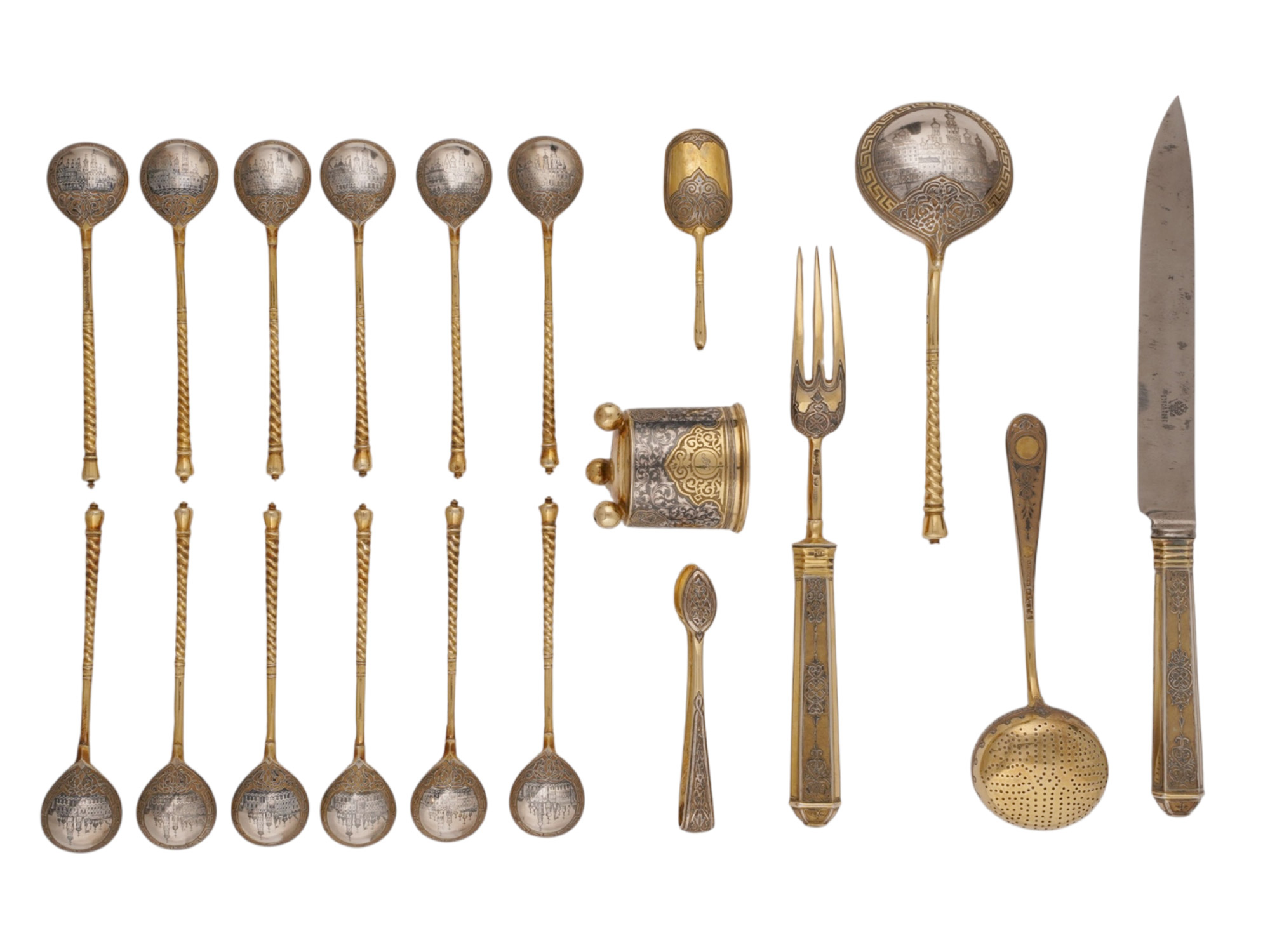A RUSSIAN CASED SILVER-GILT AND NIELLO TABLEWARE SET, PAVEL OVCHINNIKOV, MOSCOW, 1868