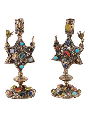 A PAIR OF VINTAGE JUDAICA SHABBAT CANDLE HOLDERS, TURKMEN MANUFACTURE. A set of two matching 