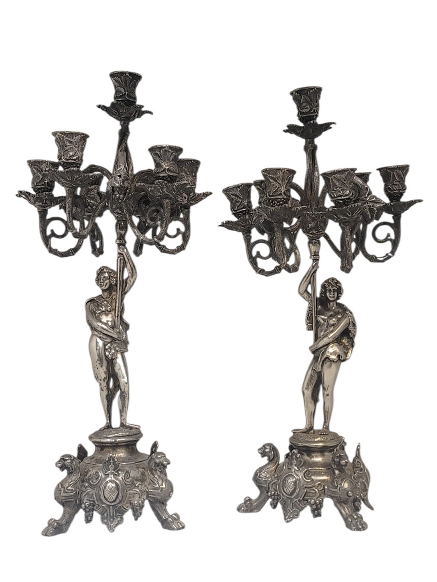 A PAIR OF SILVERED BRONZE FIGURAL FIVE-LIGHT CANDELABRA, 19TH CENTURY
