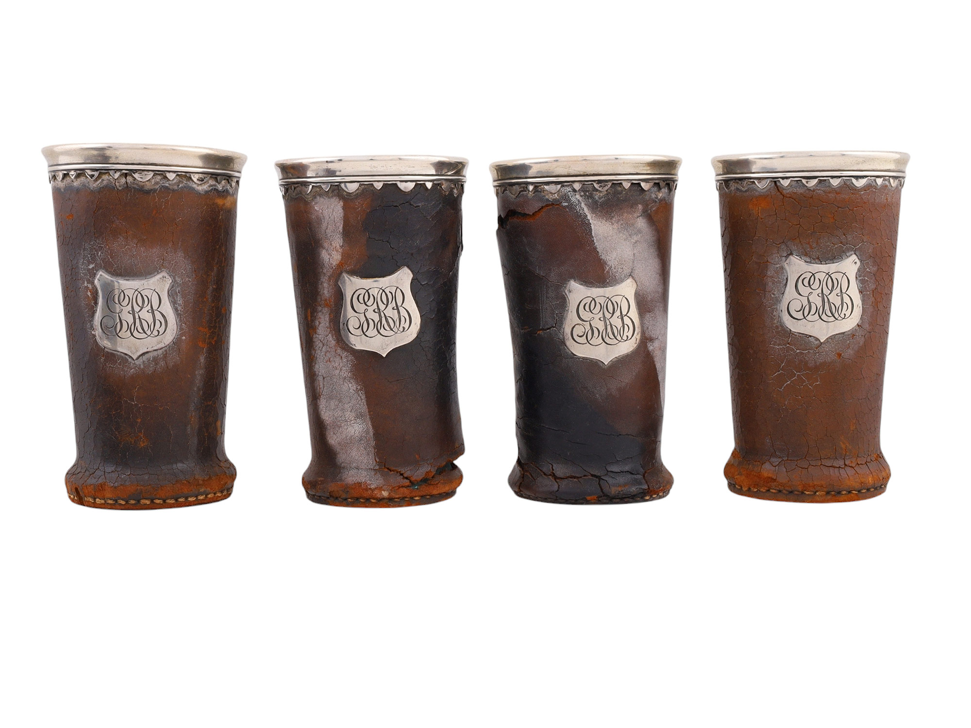 A 1906 SAN FRANCISCO FIRE AMERICAN GORHAM SILVER AND LEATHER DRINKING SET, 13 PIECES AND NEWSPAPER