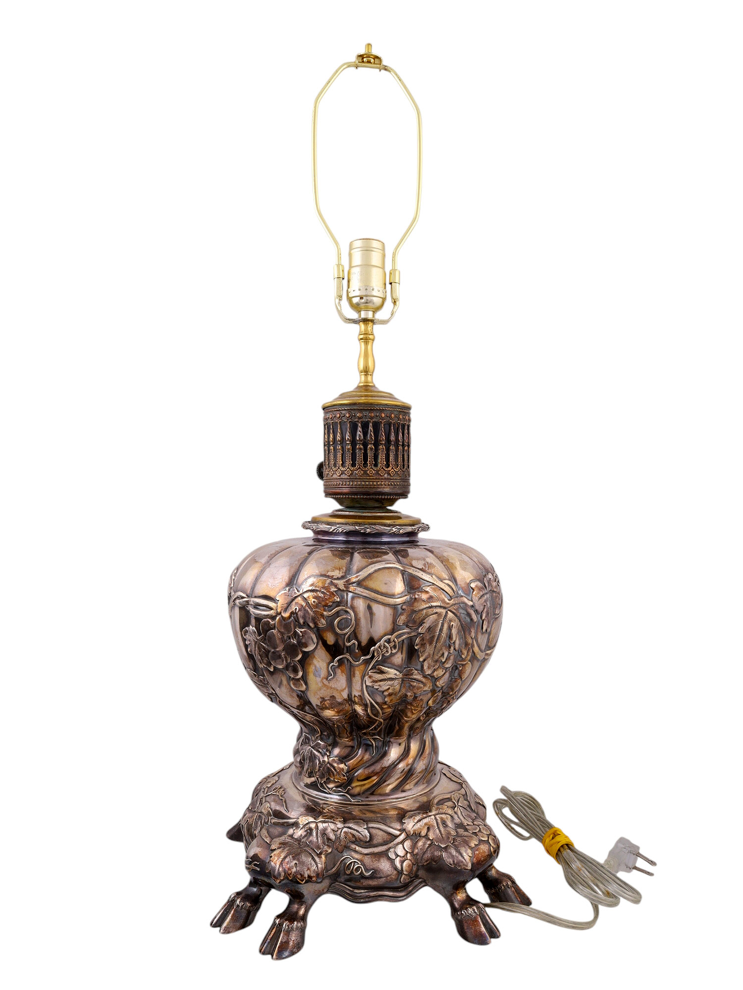 A SILVERED LAMP WITH COW FEET, CONVERTED TO ELECTRIC, PROBABLY GERMAN