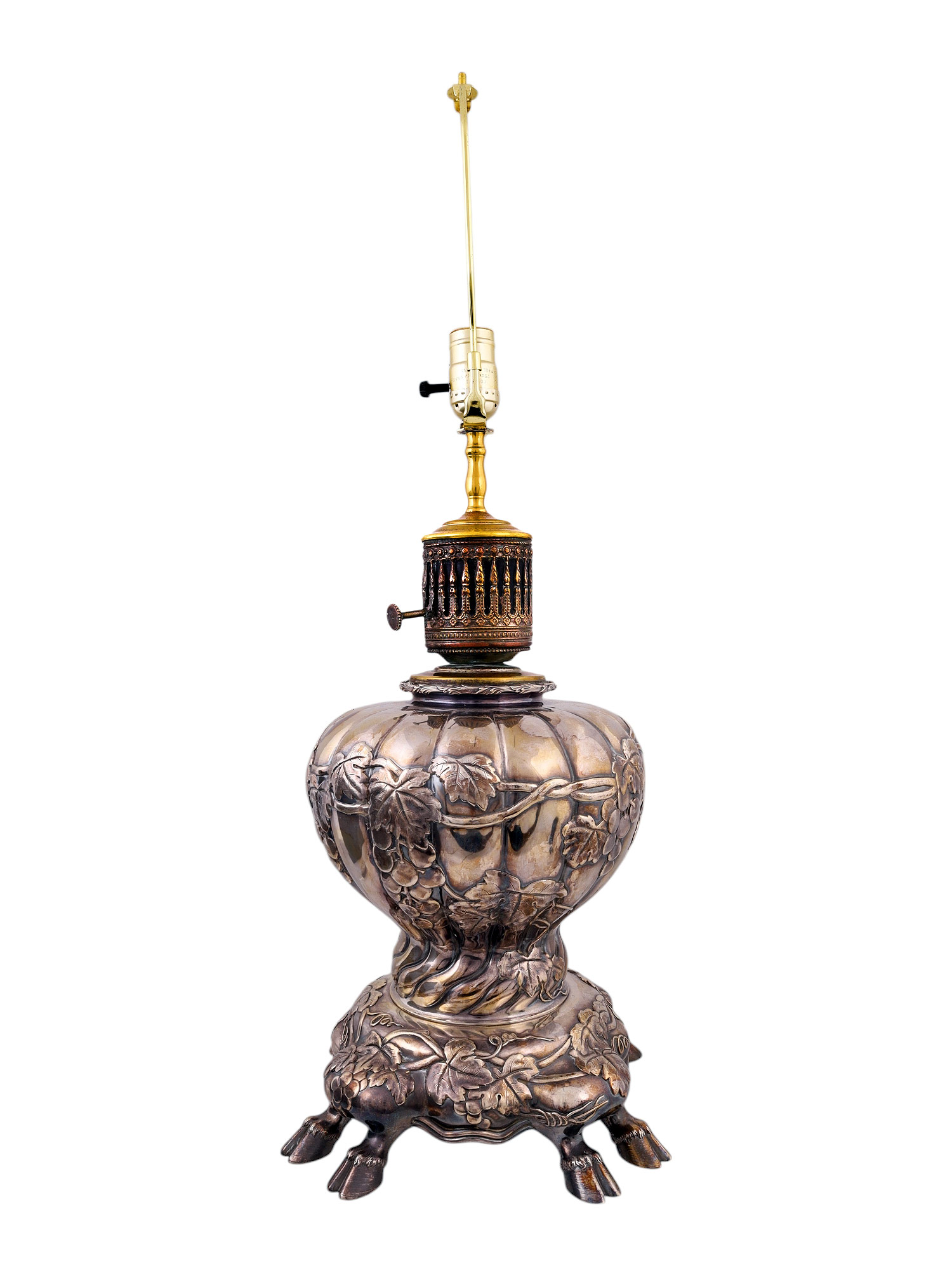 A SILVERED LAMP WITH COW FEET, CONVERTED TO ELECTRIC, PROBABLY GERMAN