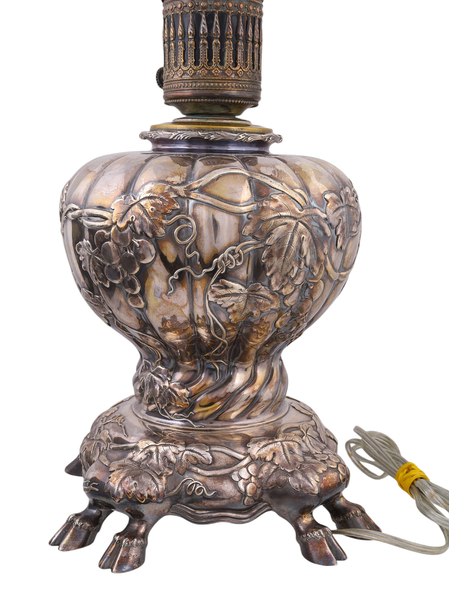 A SILVERED LAMP WITH COW FEET, CONVERTED TO ELECTRIC, PROBABLY GERMAN