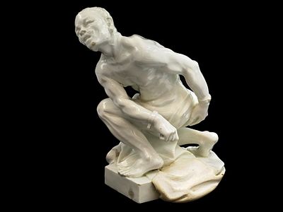 A MEISSEN PORCELAIN FIGURE OF A SLAVE BREAKING HIS CHAINS, AFTER JOHANN JOACHIM K&Auml;NDLER. A 