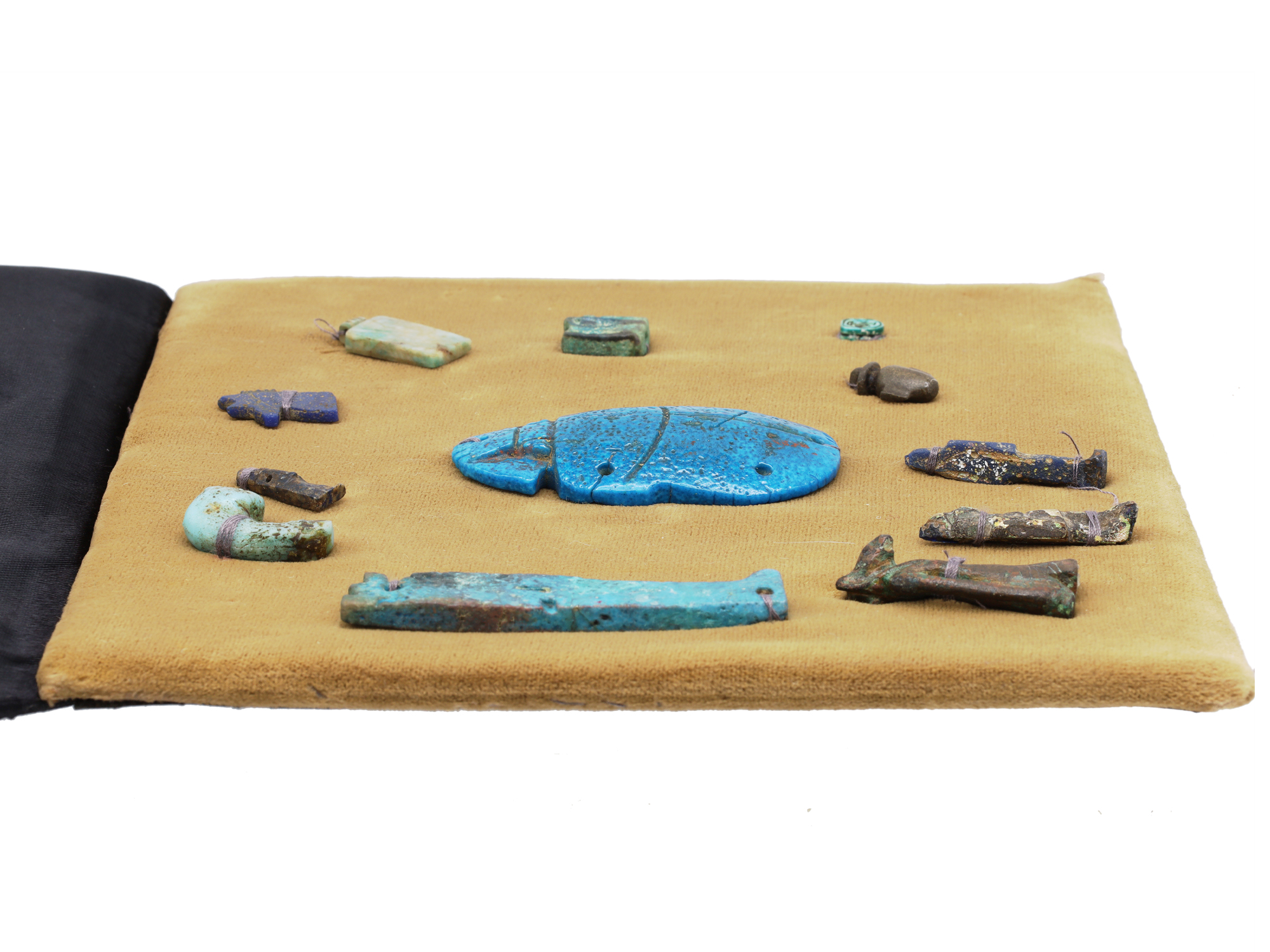A GROUP OF 12 ANCIENT EGYPTIAN FAIENCE, STEATITE AND BRONZE AMULETS