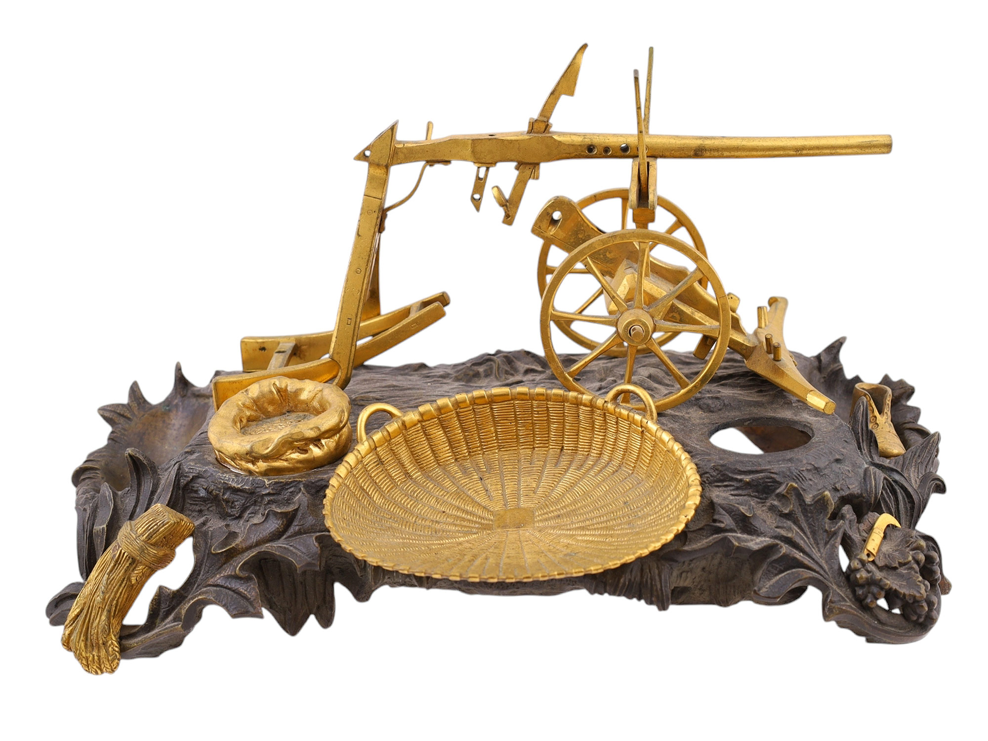 A BRONZE INKWELL REPRESENTING A PLOUGH, 19TH CENTURY.