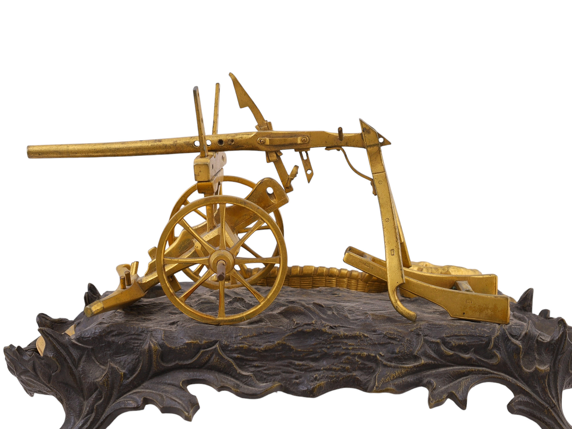 A BRONZE INKWELL REPRESENTING A PLOUGH, 19TH CENTURY.