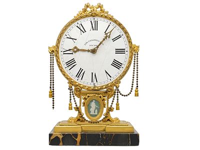 AN E.F. CALDWELL NEOCLASSICAL GILT-BRONZE, JASPERWARE AND MARBLE DESK CLOCK. American, Edward F. 