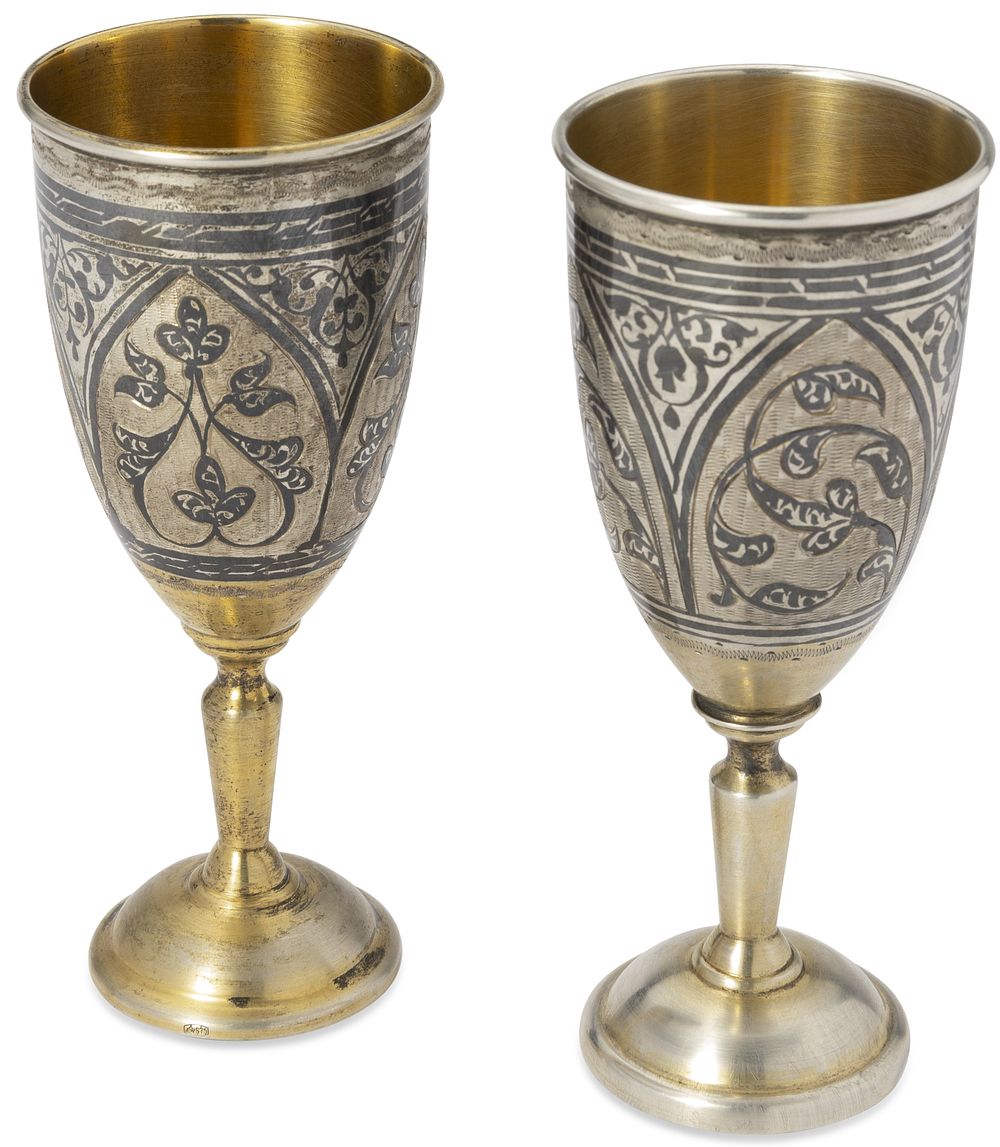 PAIR OF SOVIET PARCEL-GILT SILVER AND NIELLO FLUTES
Moscow, after 1958. Hallmarks: ‘875’ silver 