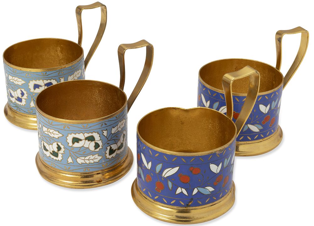 FOUR SOVIET METAL AND ENAMEL TEA GLASS HOLDERS ‘WALNUT’ AND ‘ROWANBERRY’, circa 1970s. Hallmarks: 