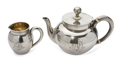 GRACHEV TEA SET COMPRISING PARCEL-GILT SILVER TEAPOT AND CREAMER WITH MONOGRAM ‘AD’
Grachev 