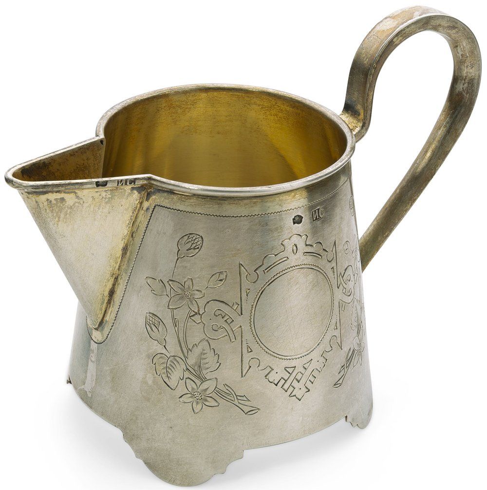 PARCEL-GILT SILVER MILK JUG ENGRAVED WITH A FLORAL MOTIF
Ivan Saltykov, 1884-1917. Hallmark: 