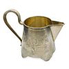 PARCEL-GILT SILVER MILK JUG ENGRAVED WITH A FLORAL MOTIF
Ivan Saltykov, 1884-1917. Hallmark: Изображение - 1