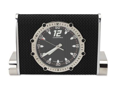 *CHOPARD ‘SUPERFAST’ TABLE CLOCK. Reference: 95020-0083 Movement: quartz H 11.2 cm; W. 17.7 cm 